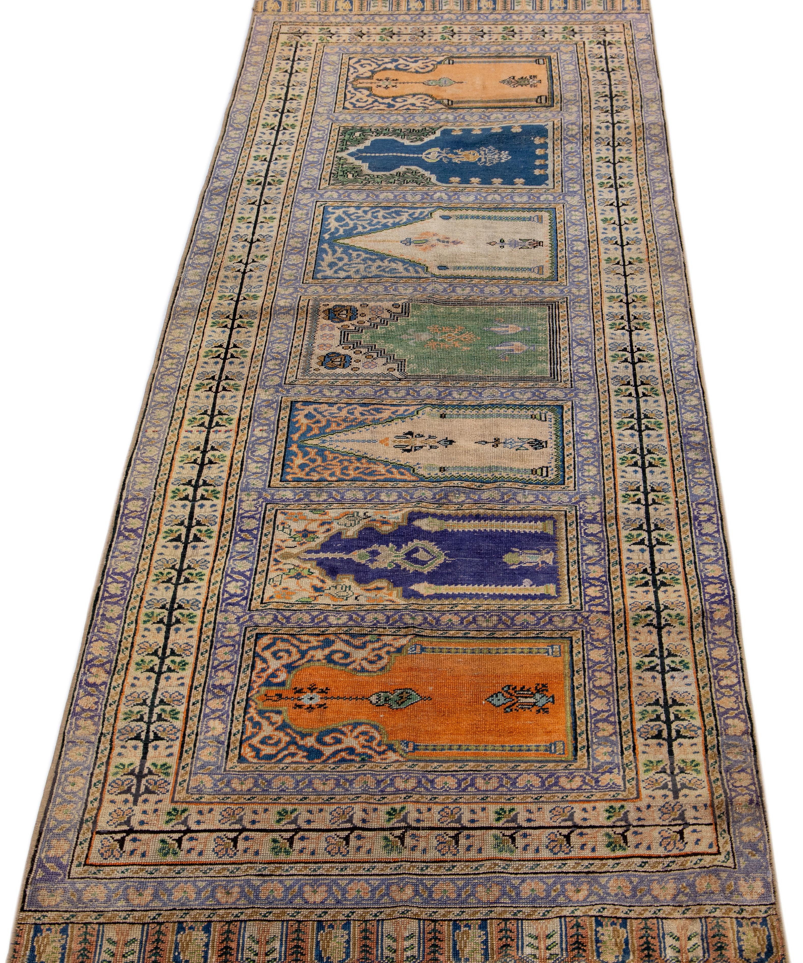 Beautiful antique Kasari hand knotted silk rug with a beige color field. This piece has multicolor accents all over the geometric pattern. This luxurious Fine art piece is crafted with intricate details and carefully chosen colors, creating an