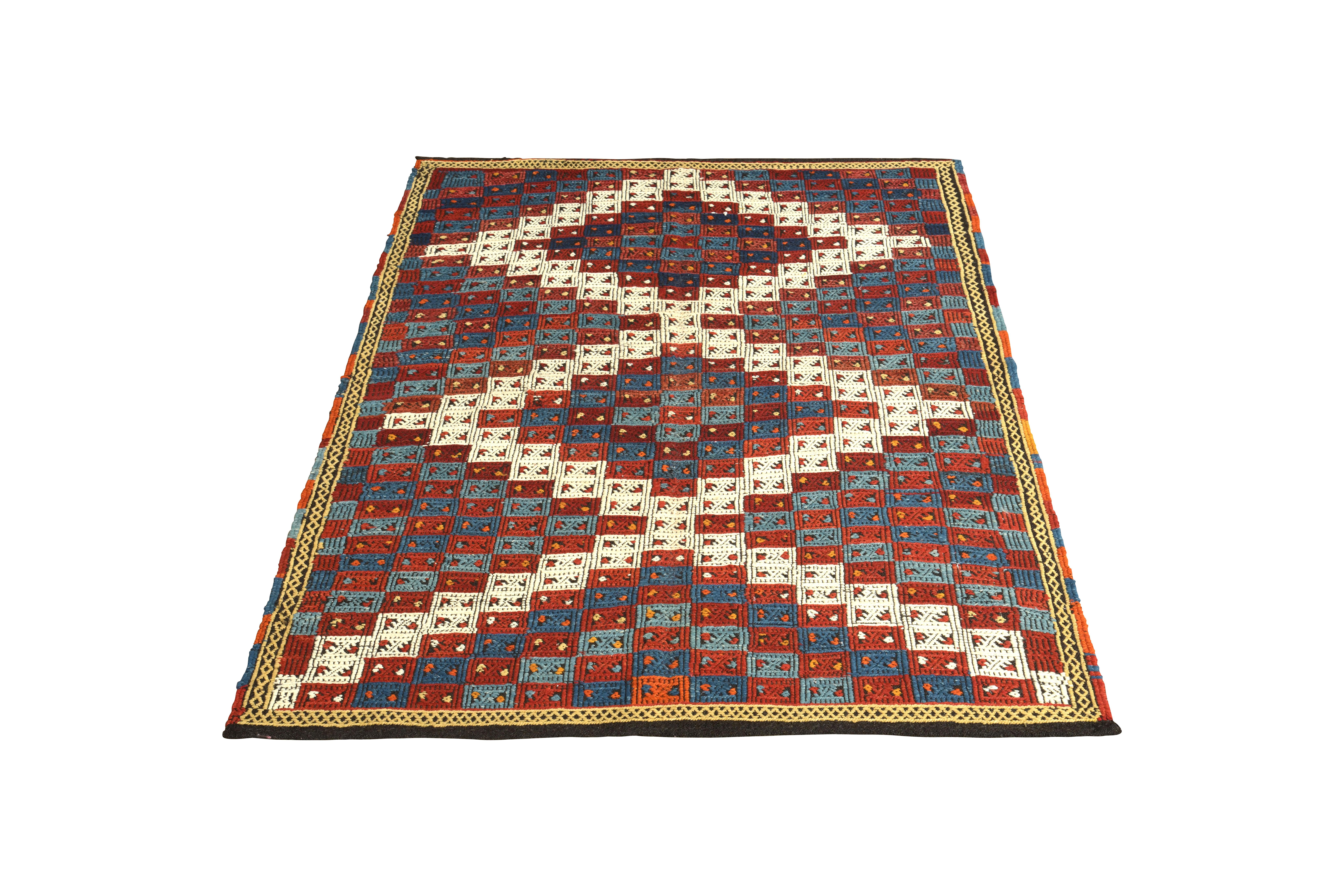 Handwoven in wool originating from Turkey circa 1950-1960, this vintage Kilim rug is celebrated in our collection as one of the finest of its kind, a very discerning play of flat-weave and embroidery techniques offering this inviting all-over