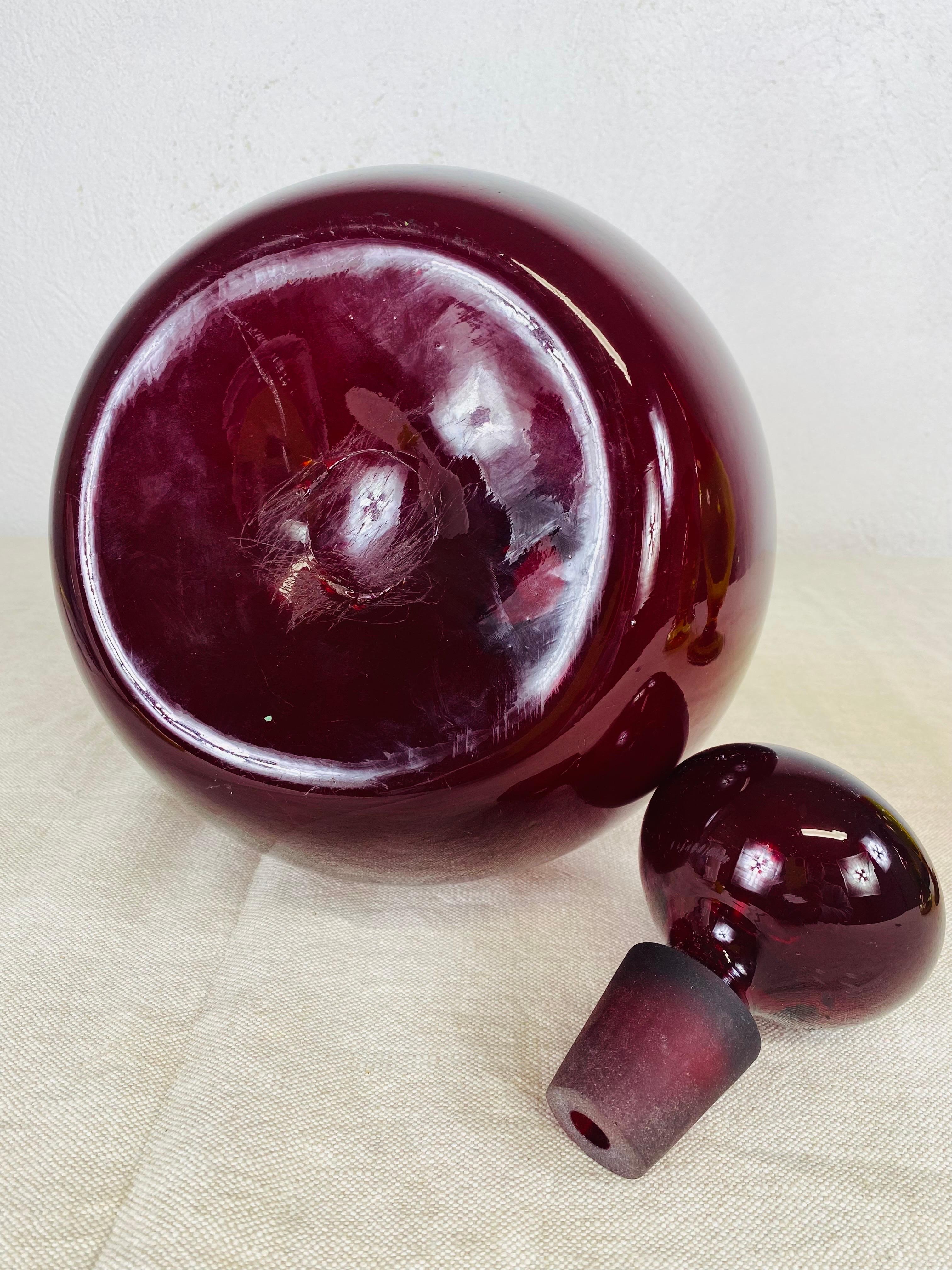 This is a mid century vintage Handblown deep ruby red Blenko jar with stopper. This is an early Blenko piece circa 1960.