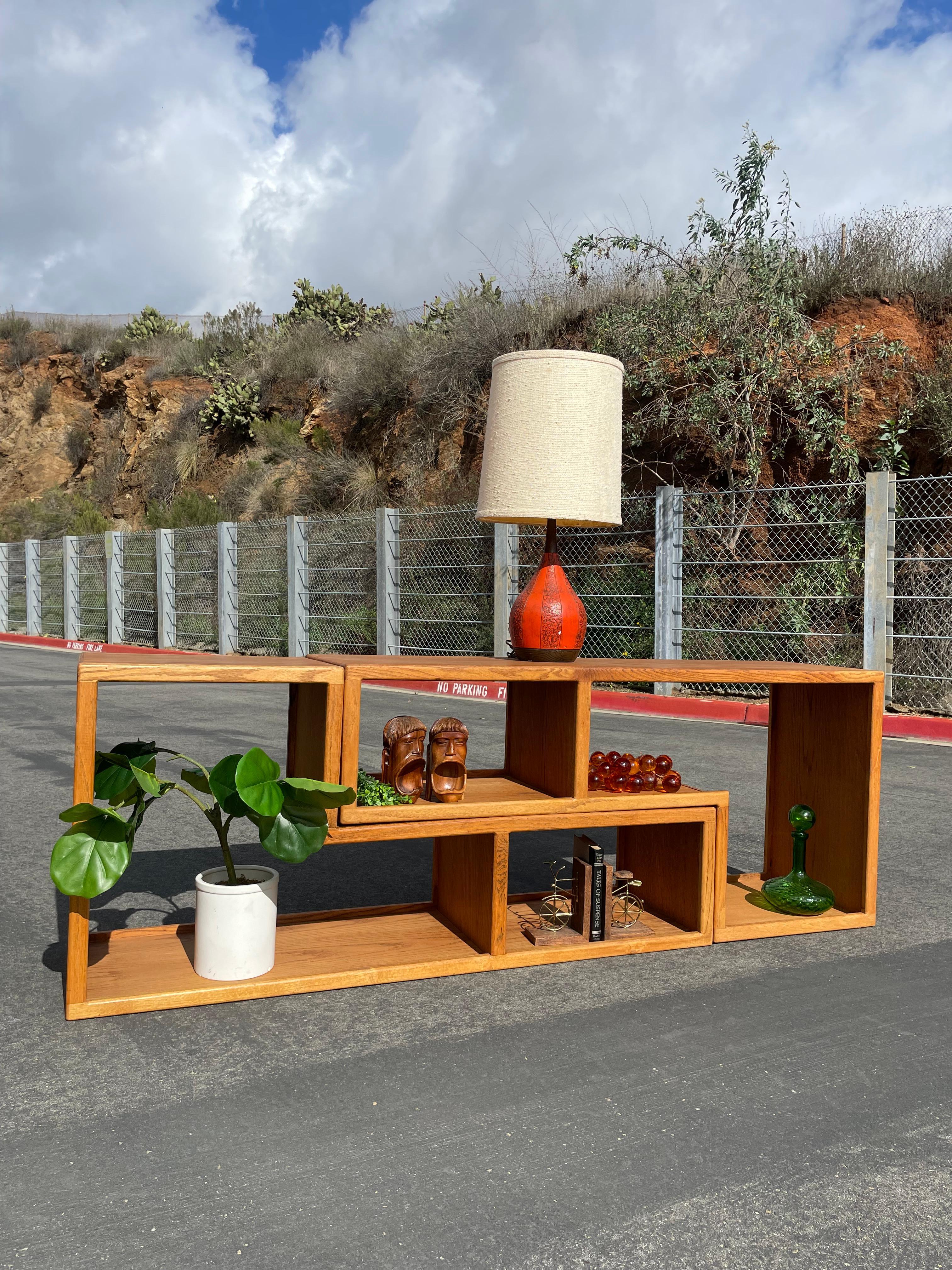 Beautiful modular, oak bookcase. These two pieces are not limited to the designs displayed here. There are other configurations you could make to fill your space. Tons of storage space beautiful wood, green detail.

