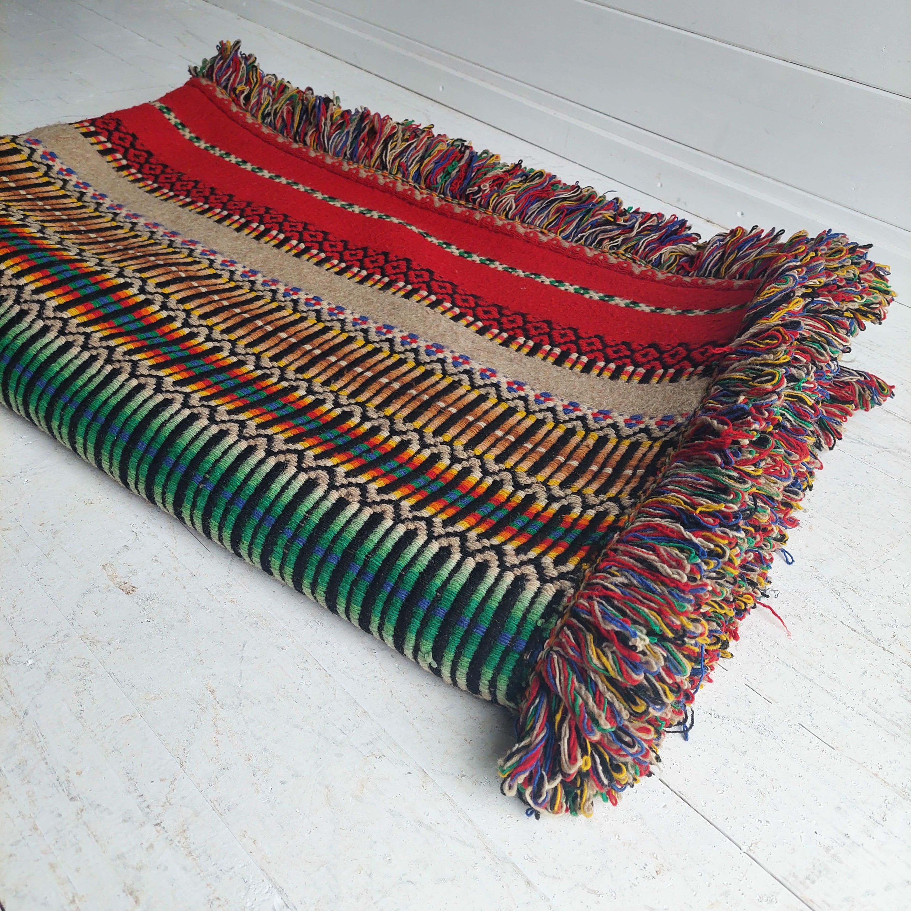 Beautiful hand made 100% wool Portuguese vintage blanket.
With intricate colourful patterns this blanket really pops.

These came out portugal from a trip during the 70s and are hard to find.

Offered here is a colorful hand woven heavyweight
