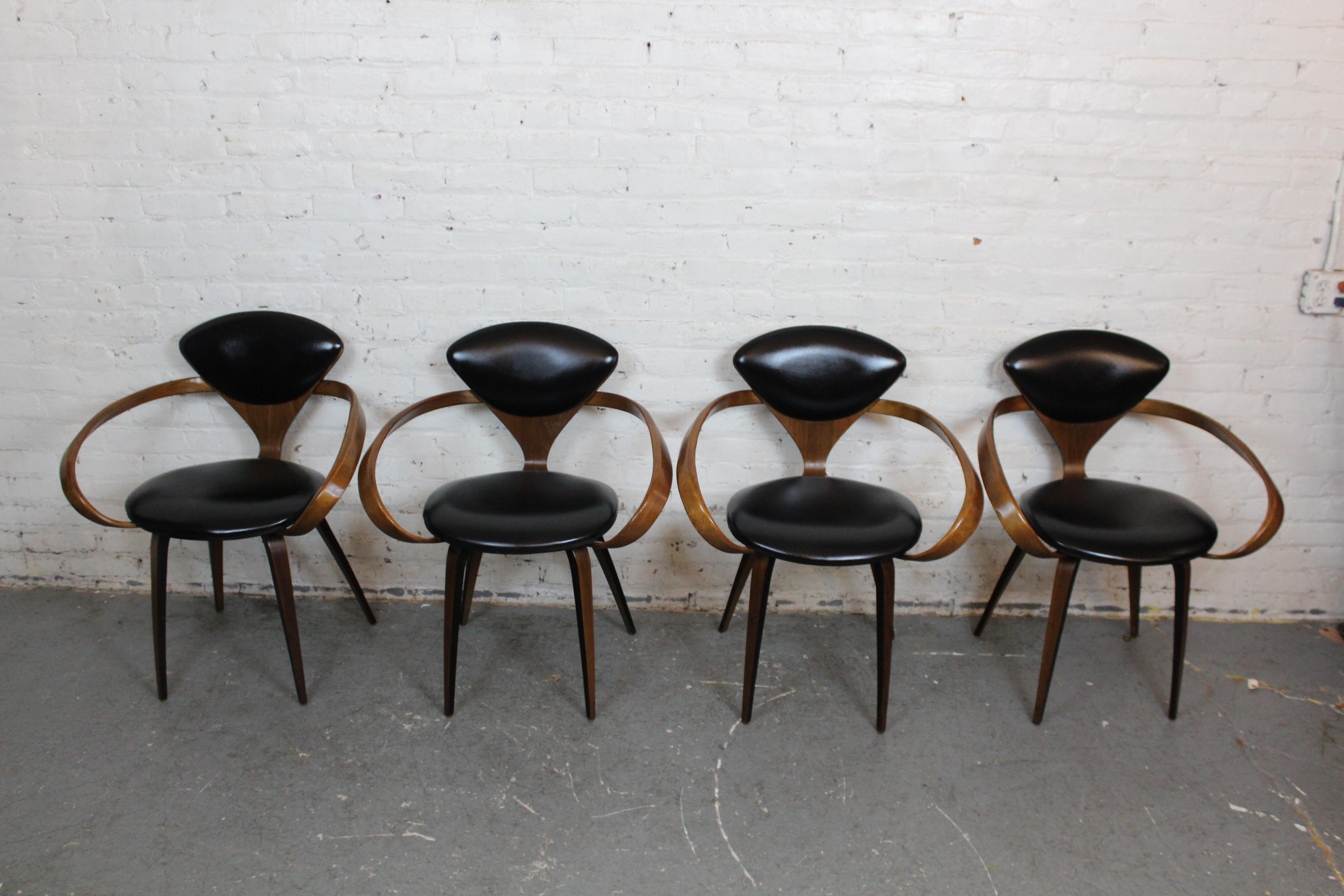 Don't miss out on an incredible set of genuine mid-century modern icons with Norman Cherner's masterpiece, the legendary 