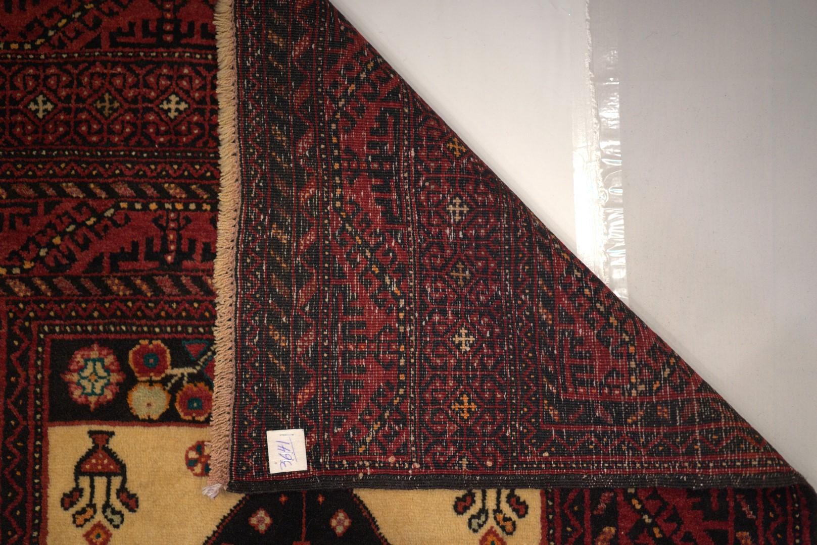 This unusual piece was actually handwoven around 1960, a period of exchange and borrowing amongst some tribal groups, by the Beluchis, who utilized or “ borrowed “ some classic Qashgai iconography in the main field, and took the border design from