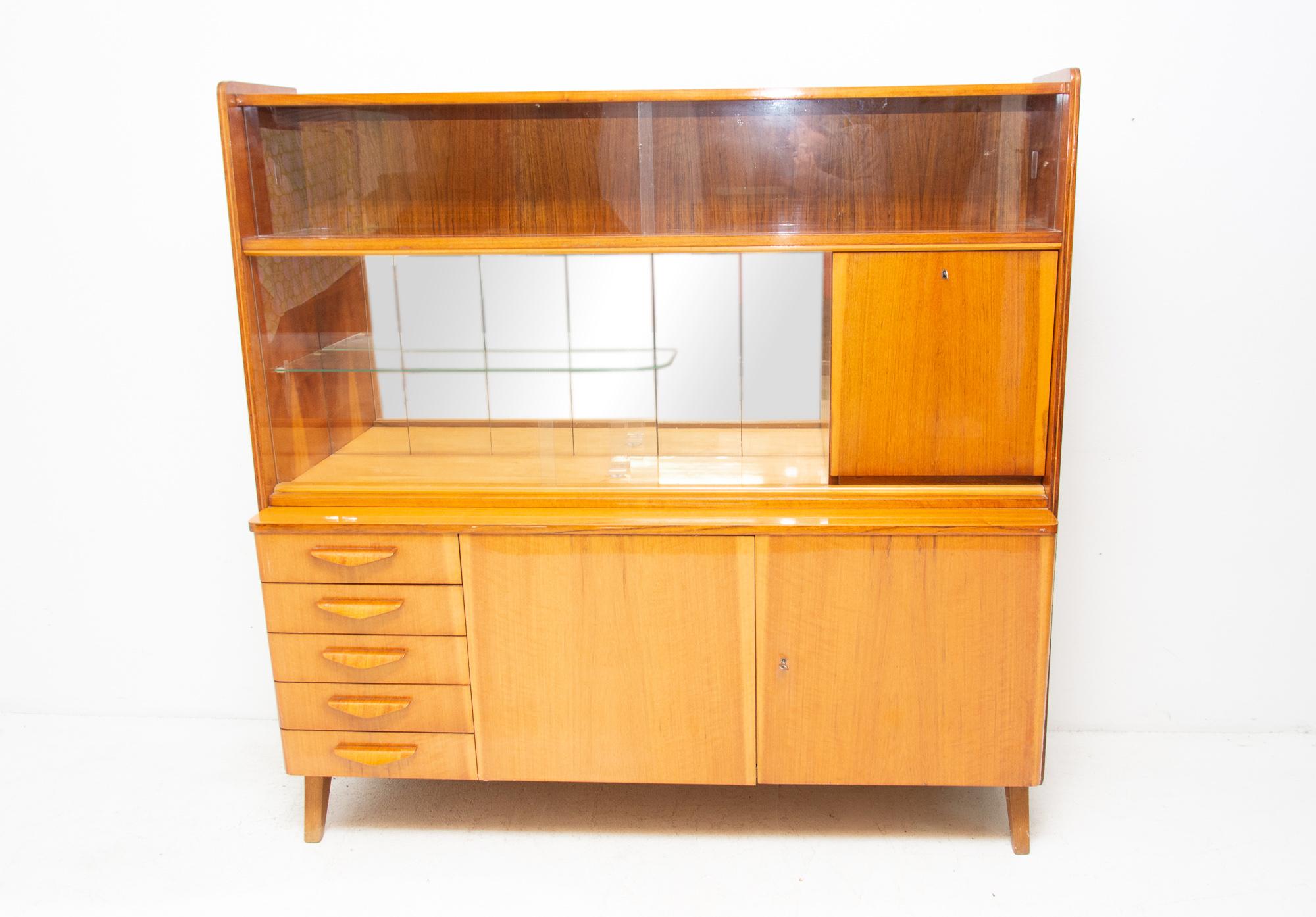 Midcentury vintage sideboard from the 1960s. It was designed by František Jirák and was manufactured by Tatra Nábytok Company in the former Czechoslovakia. Features a simple design, a glazed section can be used as a bar, bookcase etc. In very good
