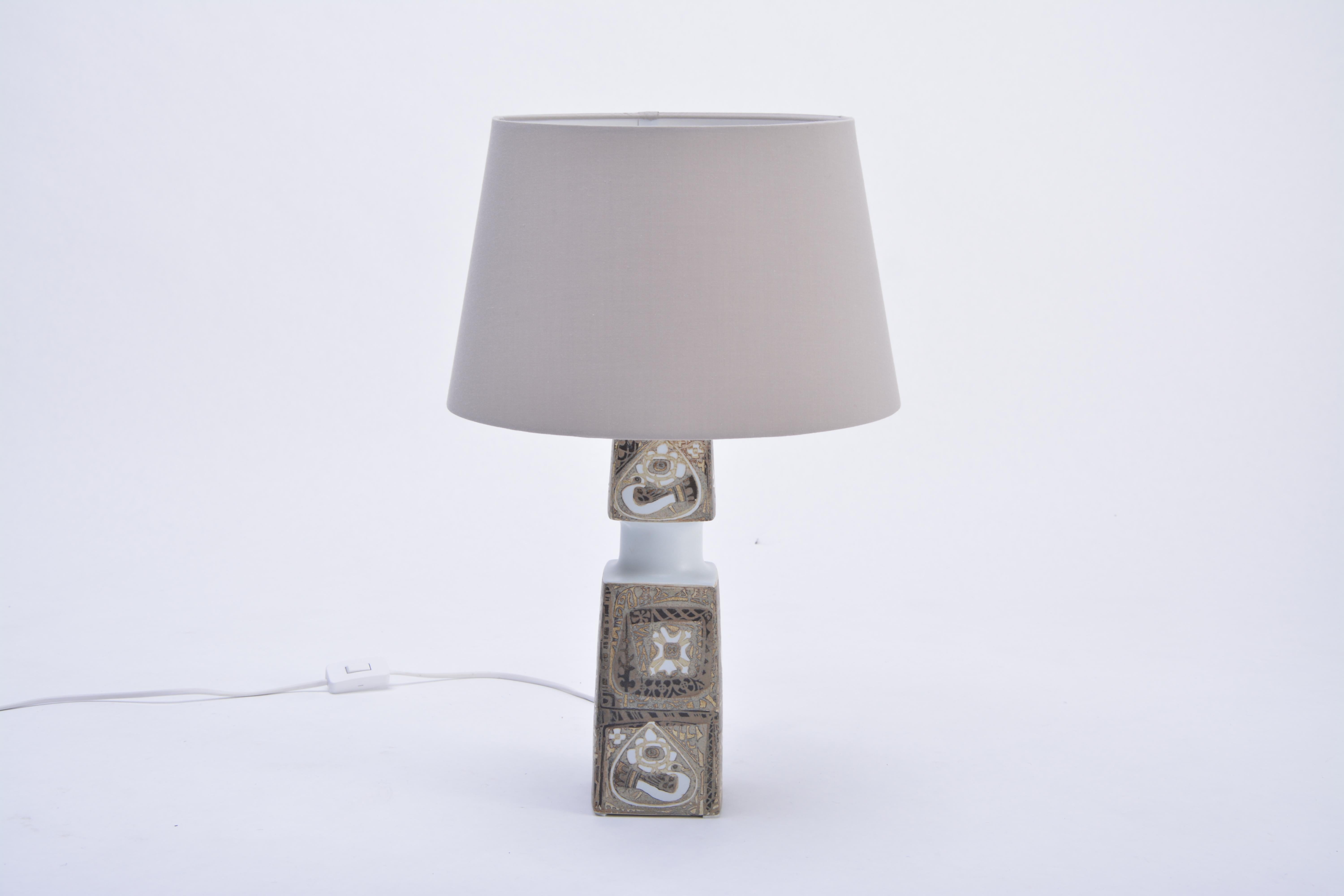 Danish Mid-Century Modern table Lamp by Nils Thorsson for Fog & Morup

This table lamp was designed by Royal Copenhagen's head designer for the BACA series, Nils Thorsson in the 1960s. It was produced by Danish company Fog & Morup. The base is made