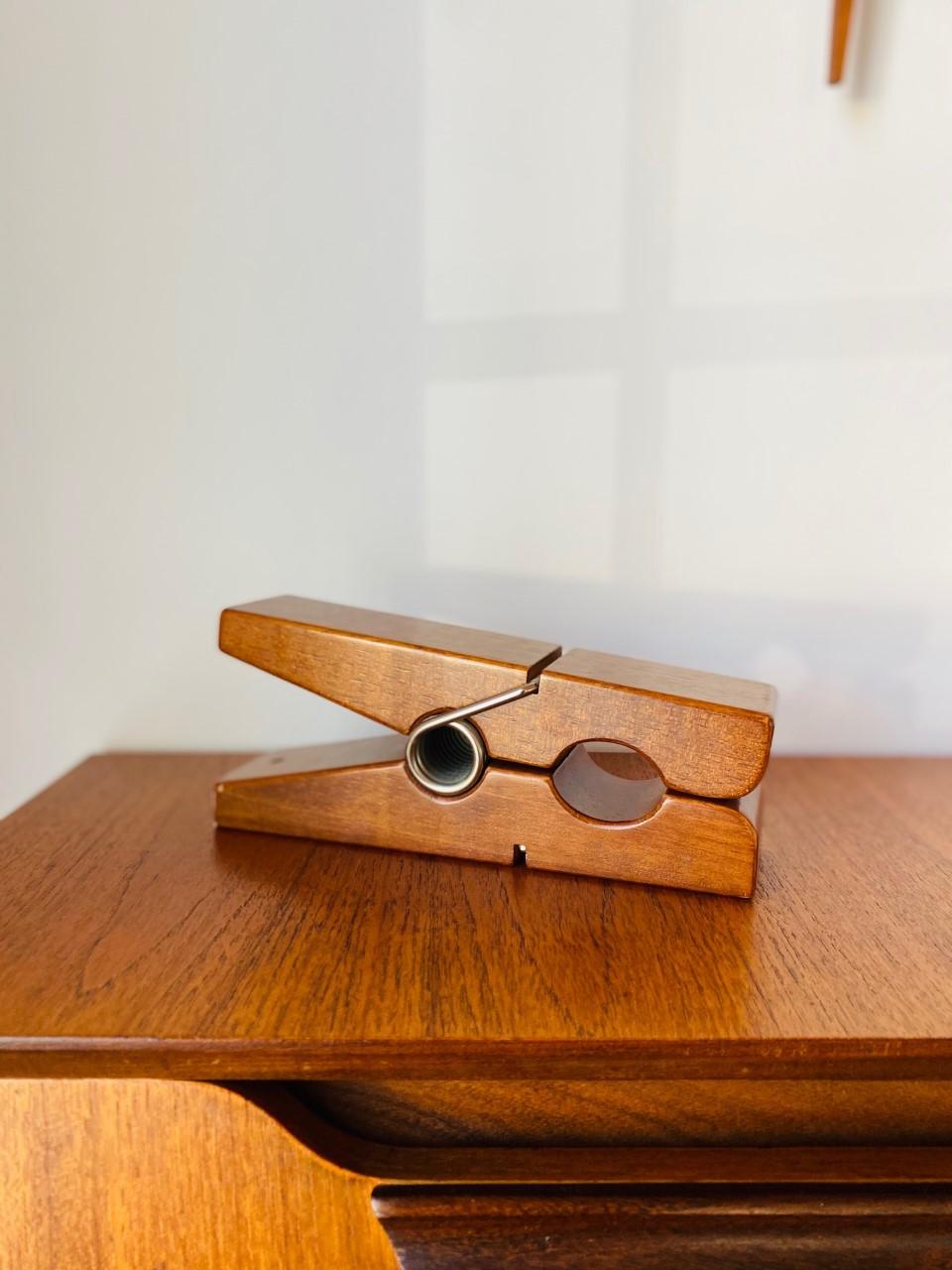 Beautifully crafted large scale teak wood clothespin figure (works like a clothespin) that adds Midcentury style to your decor. This piece will make a statement in your decor wherever it is placed.
