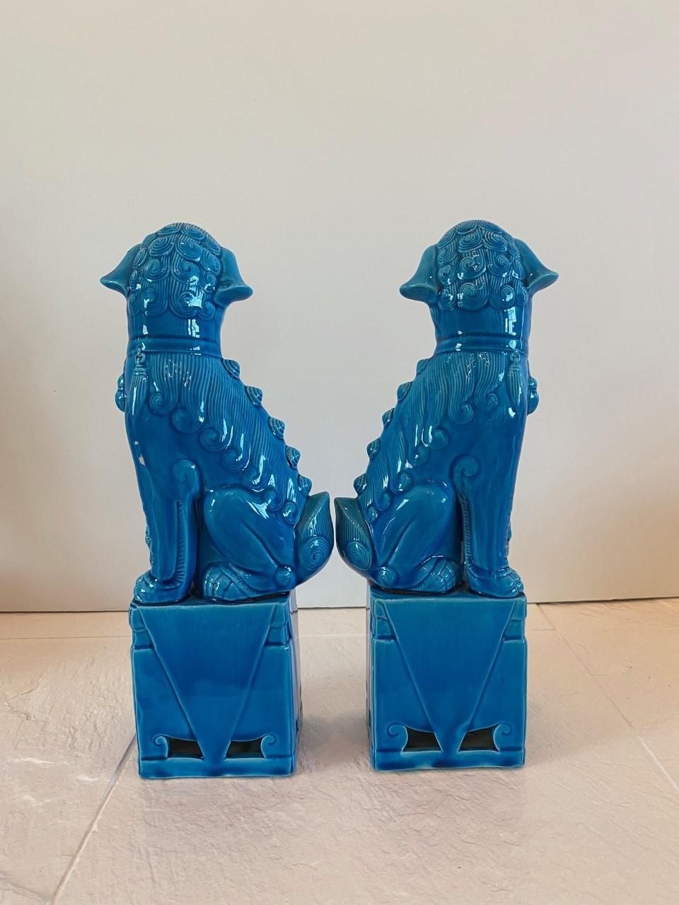 Incredible and in great condition pair of foo dog sculptures. These symbolic guardians present a beautiful turquoise hue along with the beautiful lines and swirls that each of the figures present.
Measures: 12 inches tall, 3.75 inches wide.
  