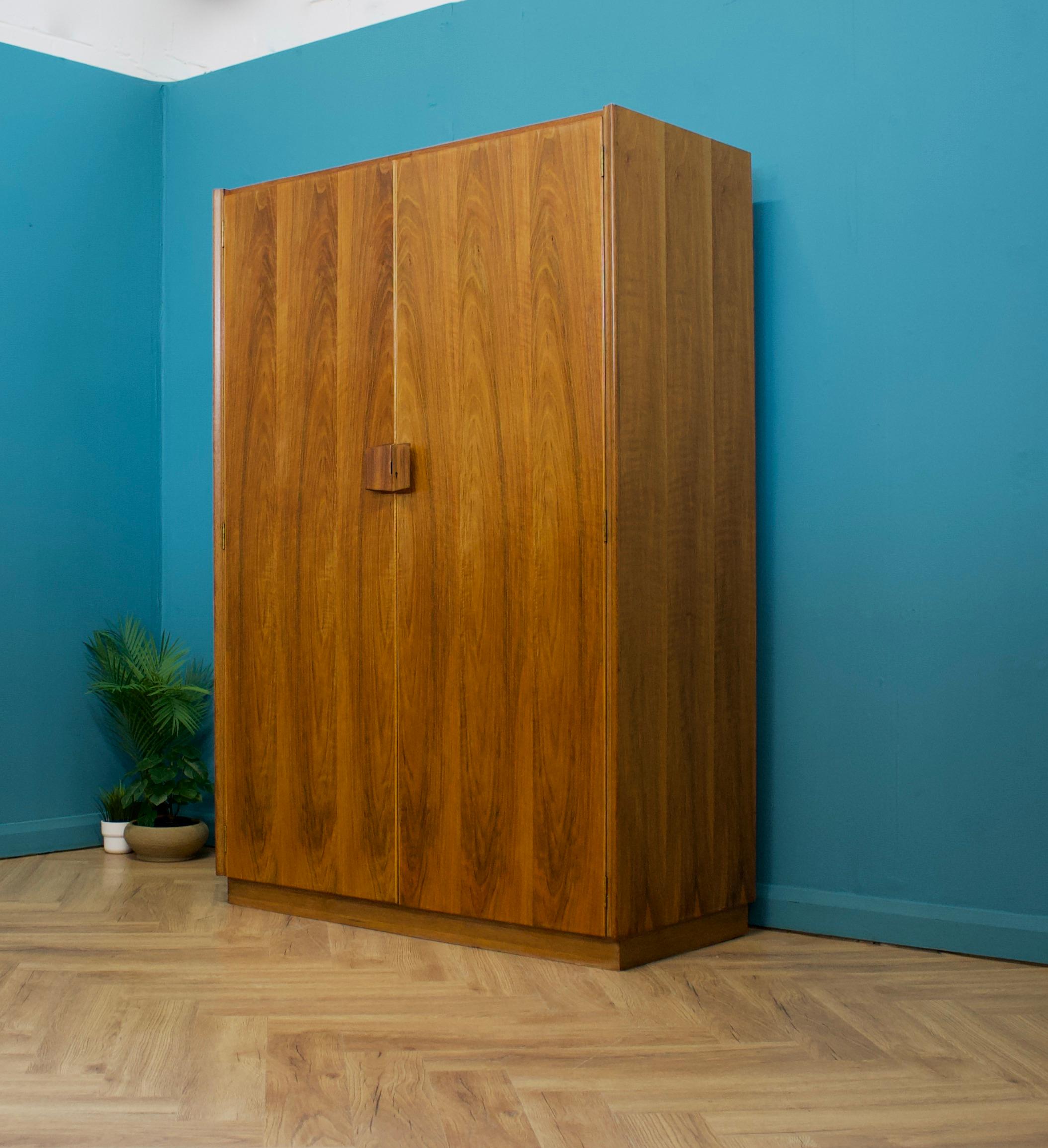 A walnut freestanding wardrobe by Gordon Russell - circa 1950s
Internally there are two rails and a shelf