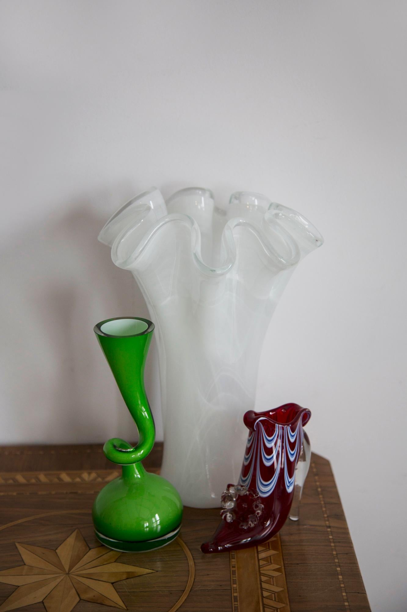 Beautiful vase made from Murano glass in perfect condition. The vase looks like it has just been taken out of the box. No jags, defects etc. Only one unique piece. 

Venetian glass (Italian: vetro veneziano) is glassware made in Venice, typically on