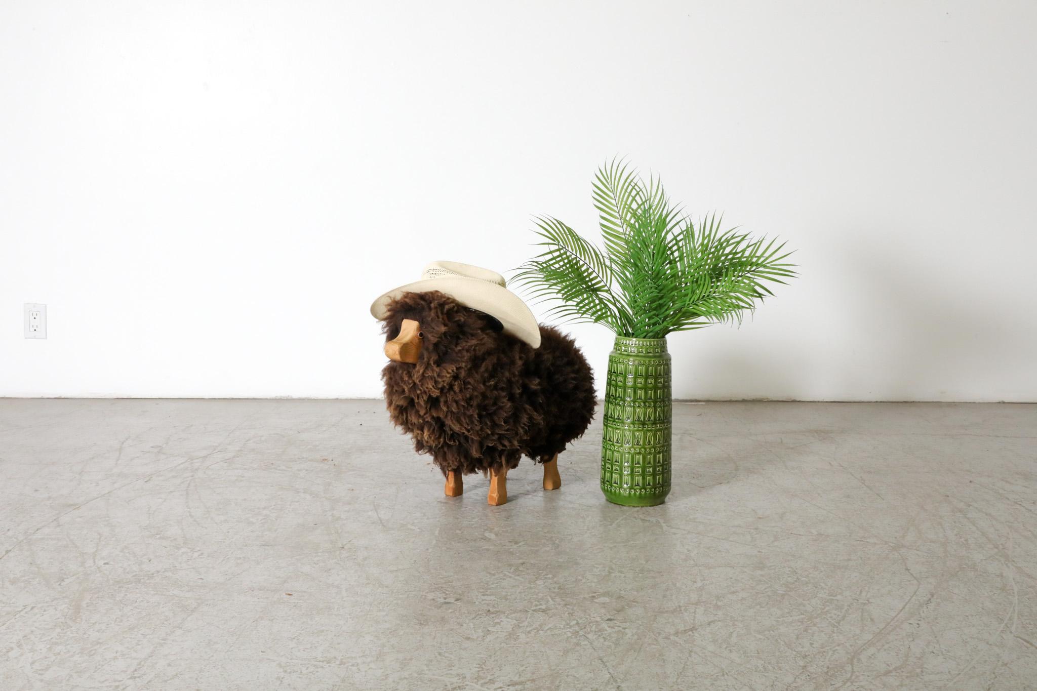 Cute, Mid-Century,  decorative sheep by Waldorf with genuine brown sheep wool and a carved wood face and legs. Vintage accent piece with leather ears and light patina. In original condition with some age appropriate wear. Other sheep also available