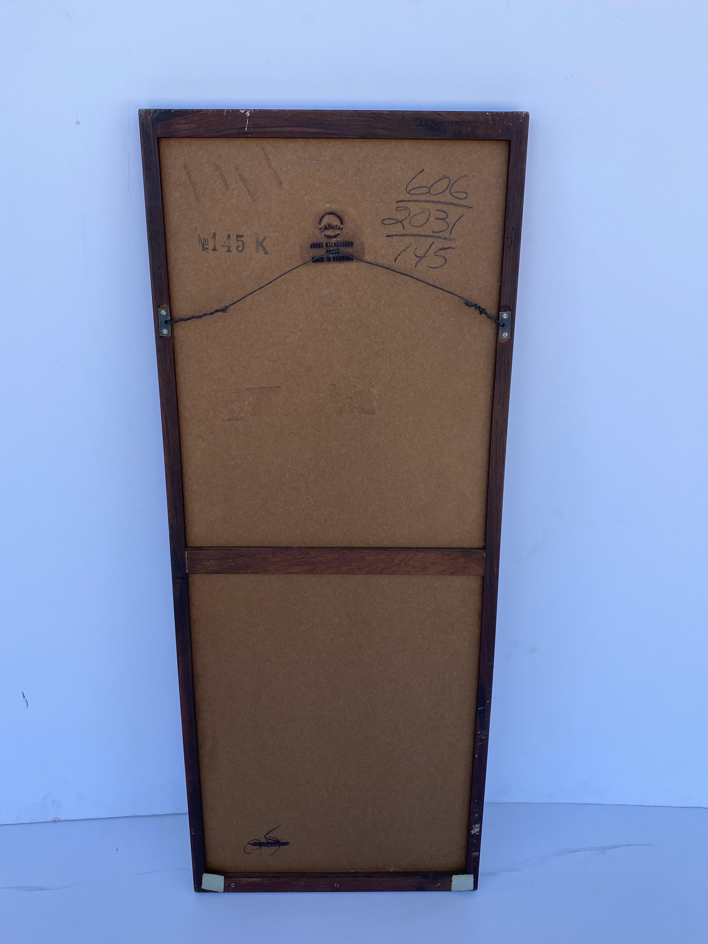 Mid-century rosewood wall mirror.