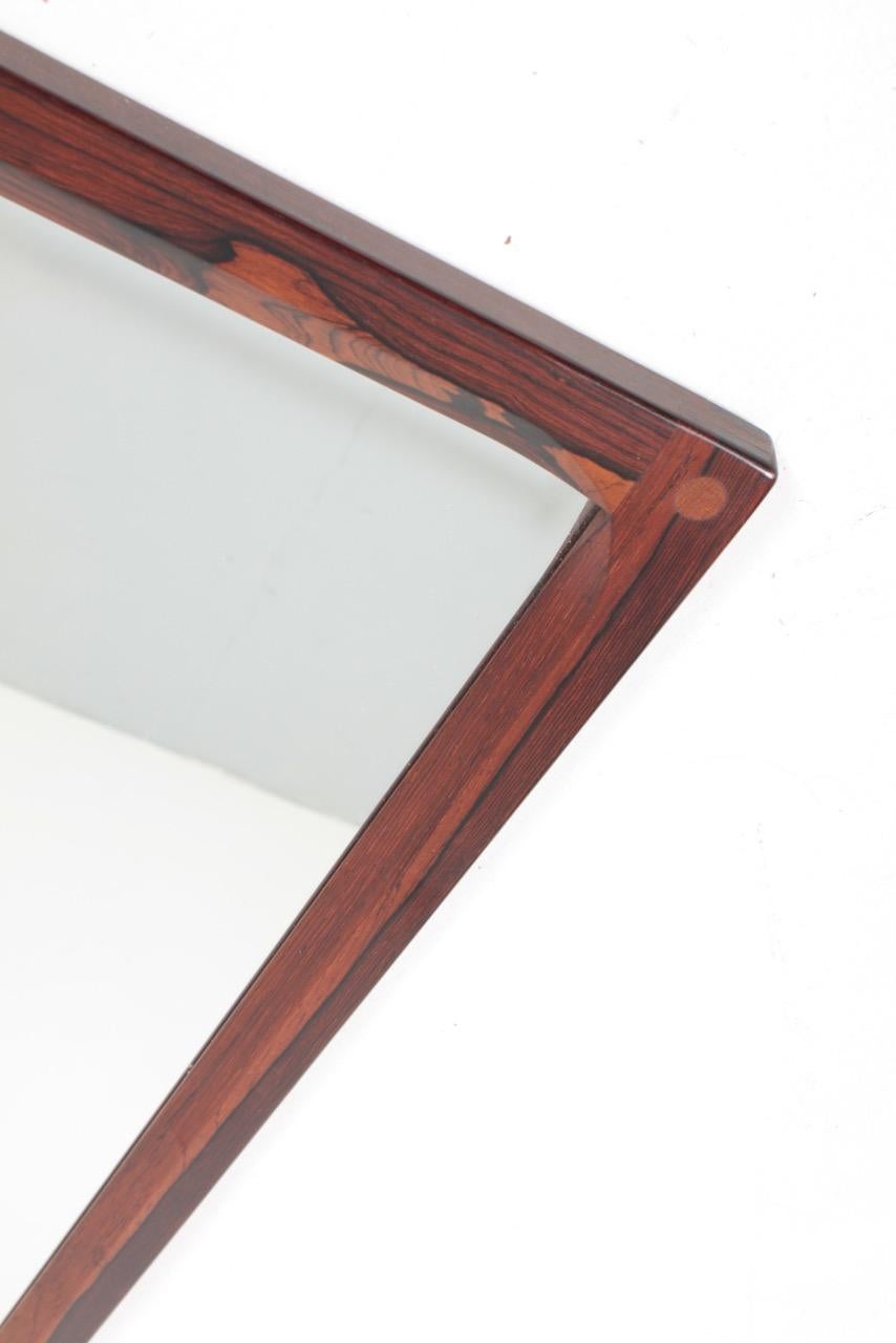 Wall mirror with frame in rosewood. Designed by Kai Kristiansen, made by Aksel Kjersgaard Denmark. Great original condition, circa 1960.