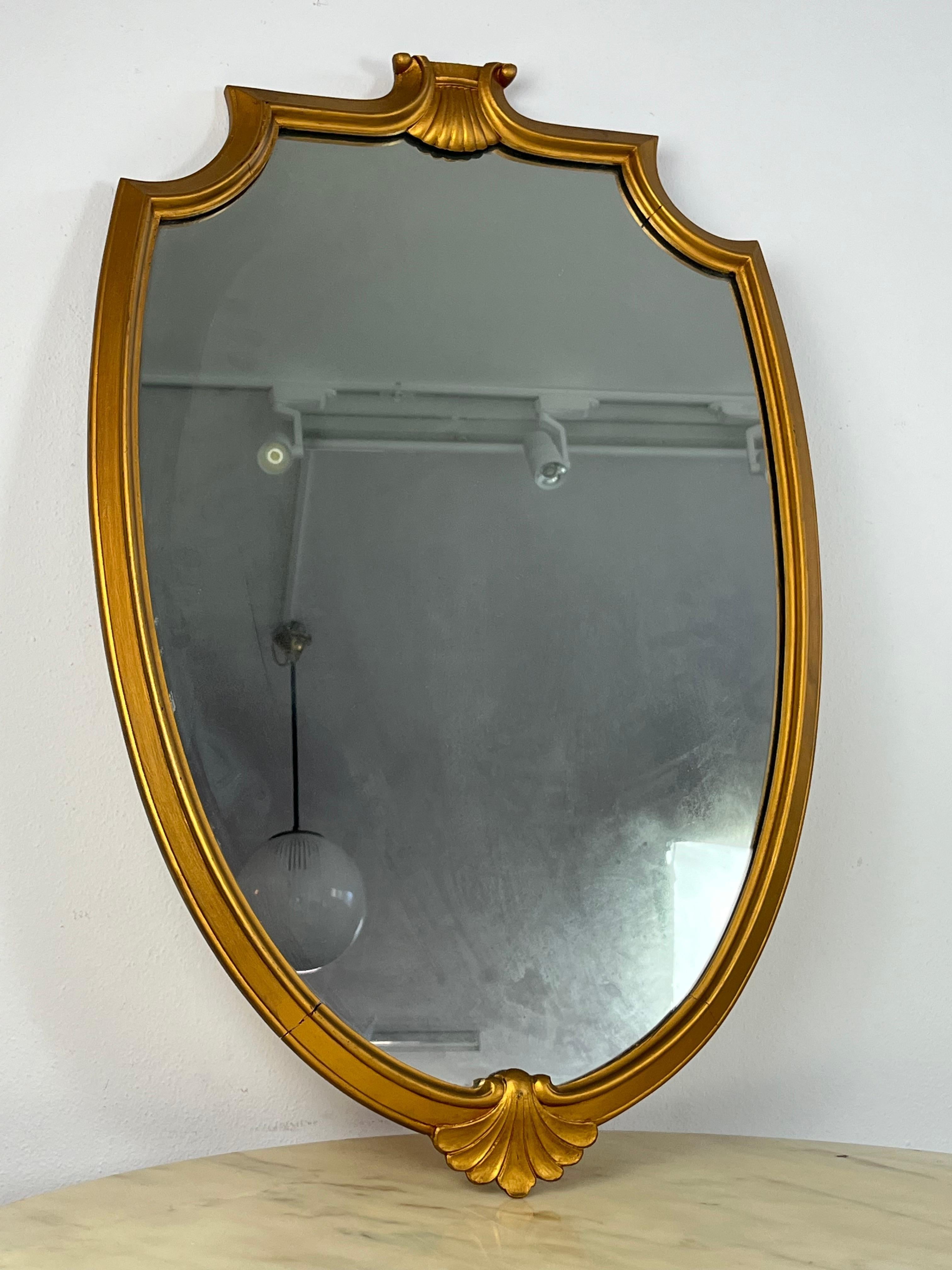 Mid-Century wall mirror, Italy, 1960s
Gilt wood border. 
Found in a noble apartment.
