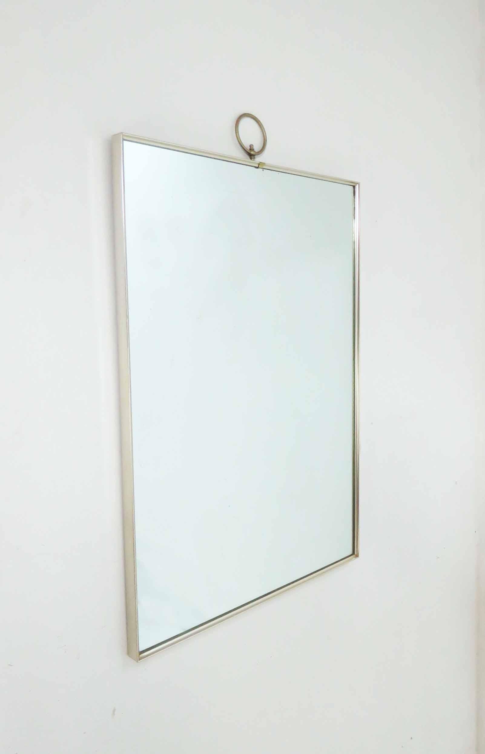 Striking modernist wall mirror in sleek anodized aluminum with ring finial, circa 1960s, by Turner.