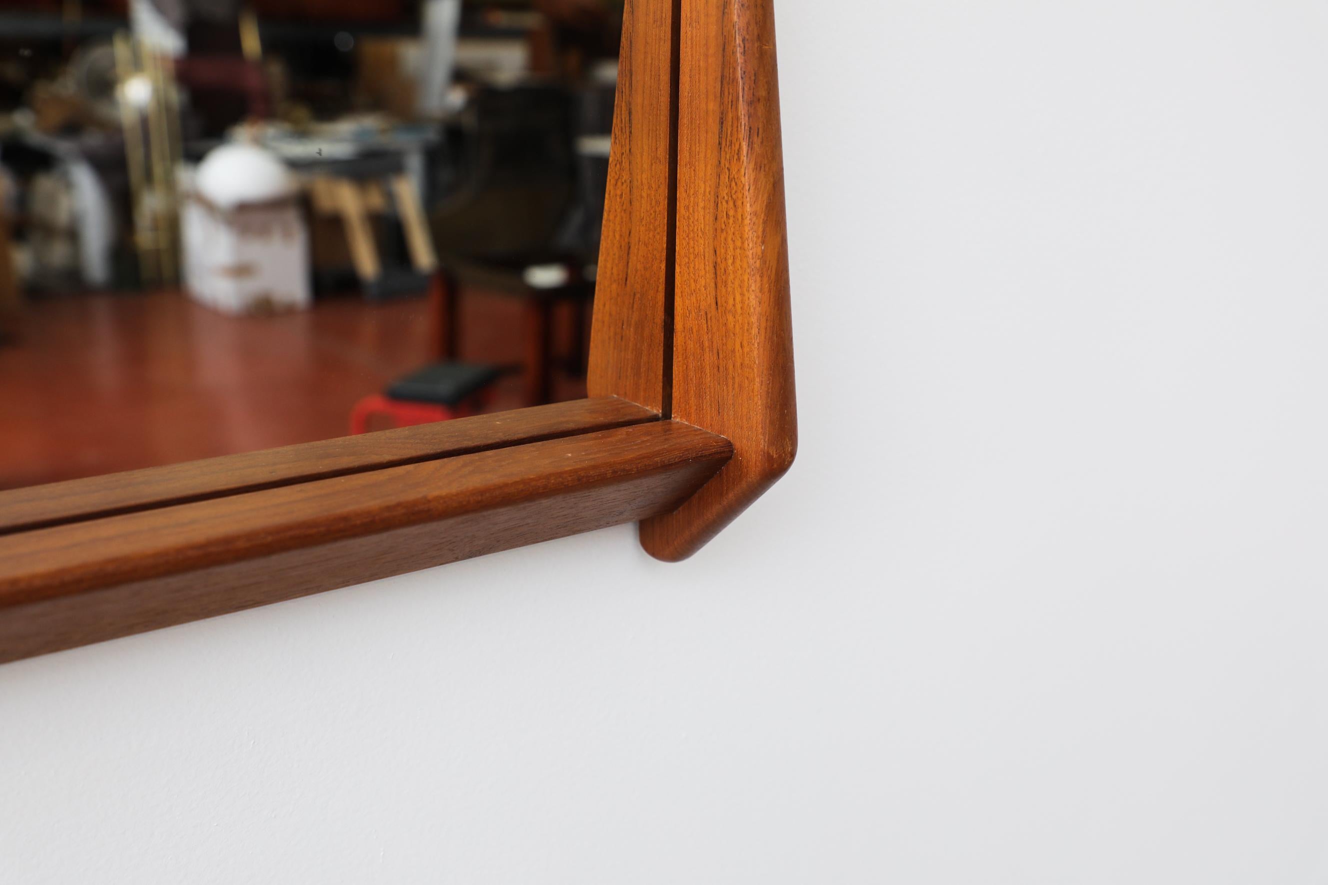 Mid-20th Century Mid-Century Wall Mounted Mirror w/ Rounded Triangular Teak Frame & Lower Lip For Sale