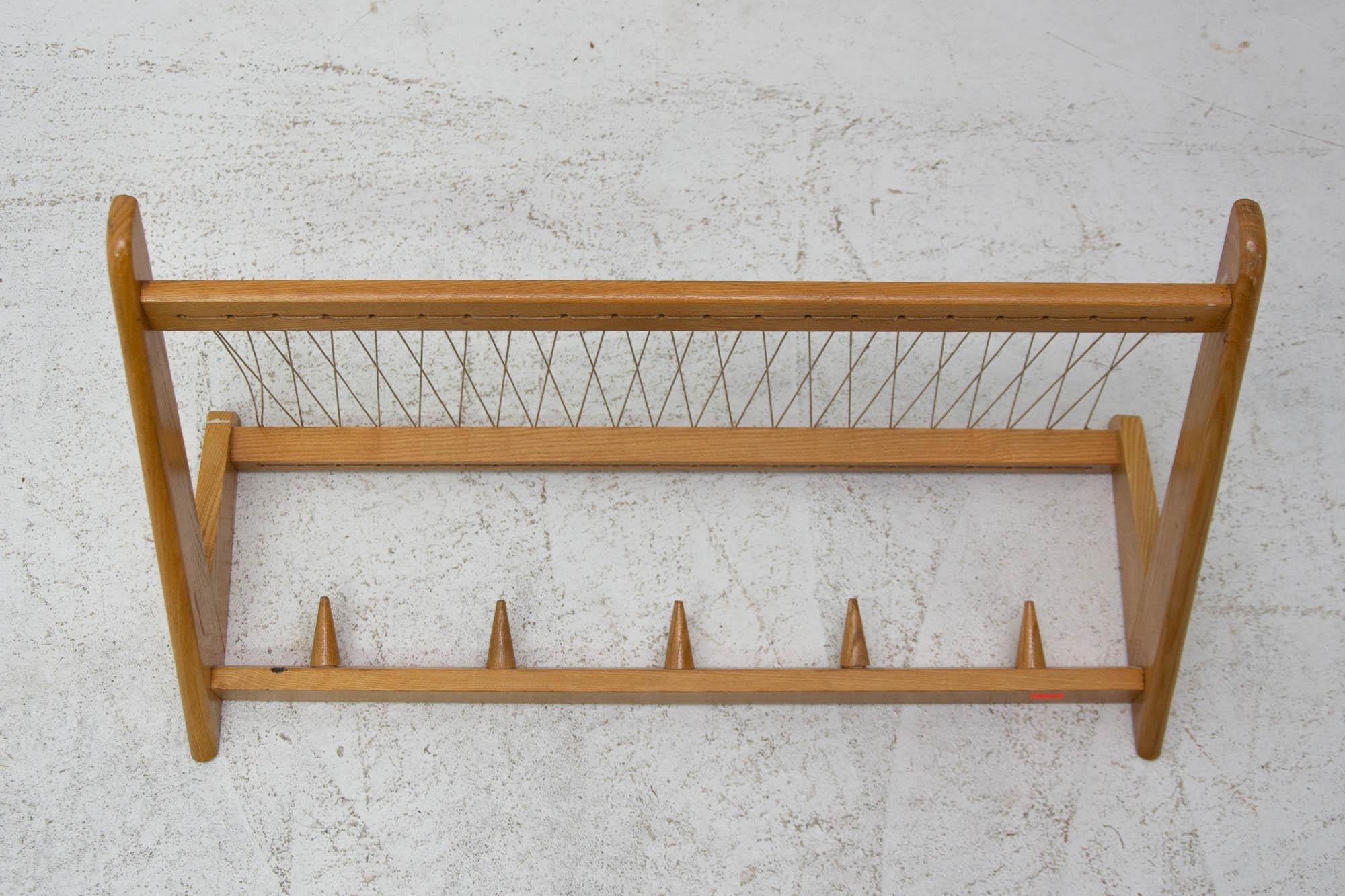 Vintage wall shelf, made in the former Czechoslovakia in the 1960s. It was produced by Krásná Jizba company. It’s made of beech wood and an intertwined upper part. In very good Vintage condition.