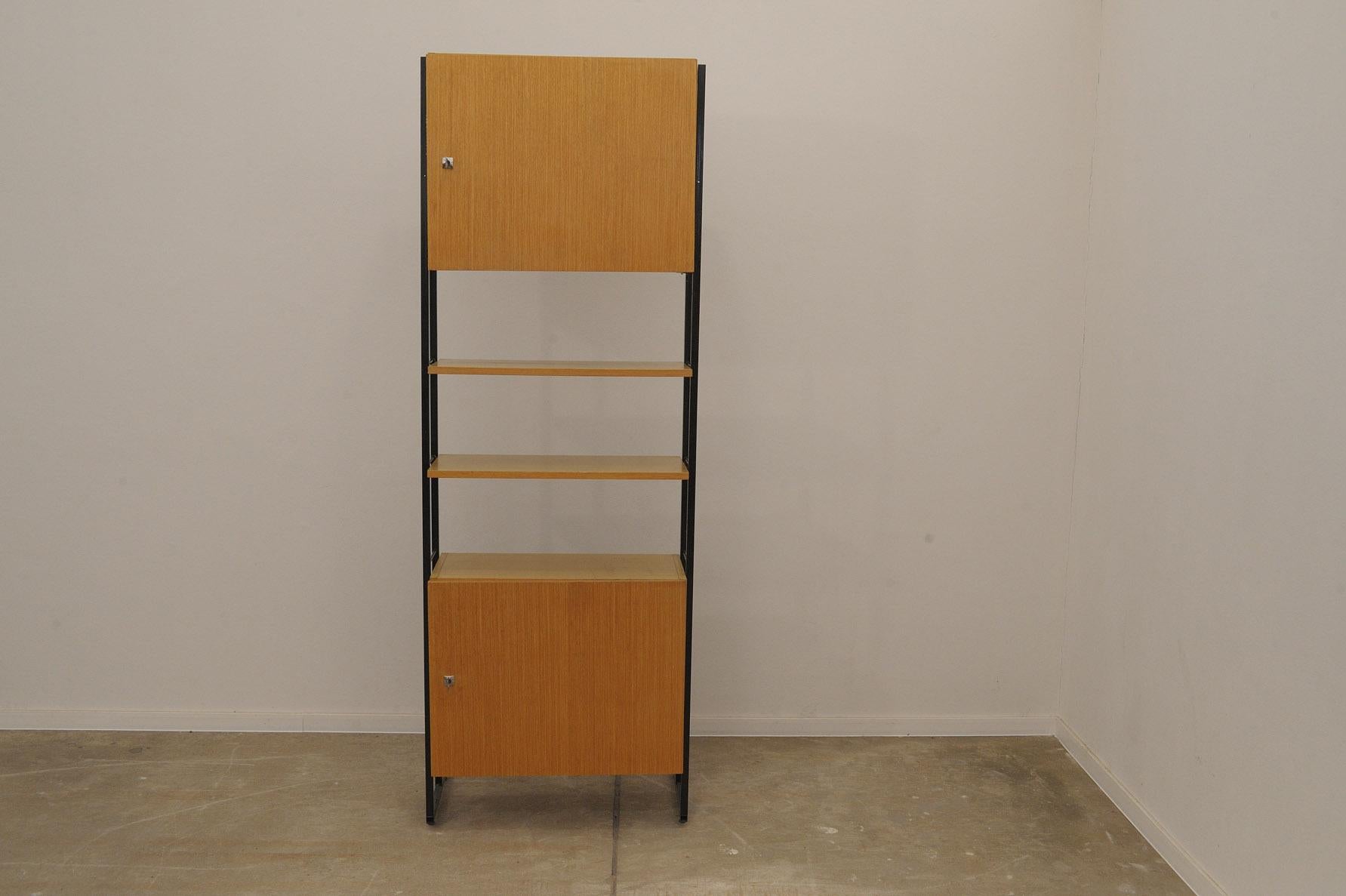 Mid century wall shelf system from the 1980´s. It was made in the former Czechoslovakia.
It can also be used as a bar or bookcase.
It´s made of wood, plywood and iron.
It´s fully demountable.
In good Vintage condition, showing slight signs of wear