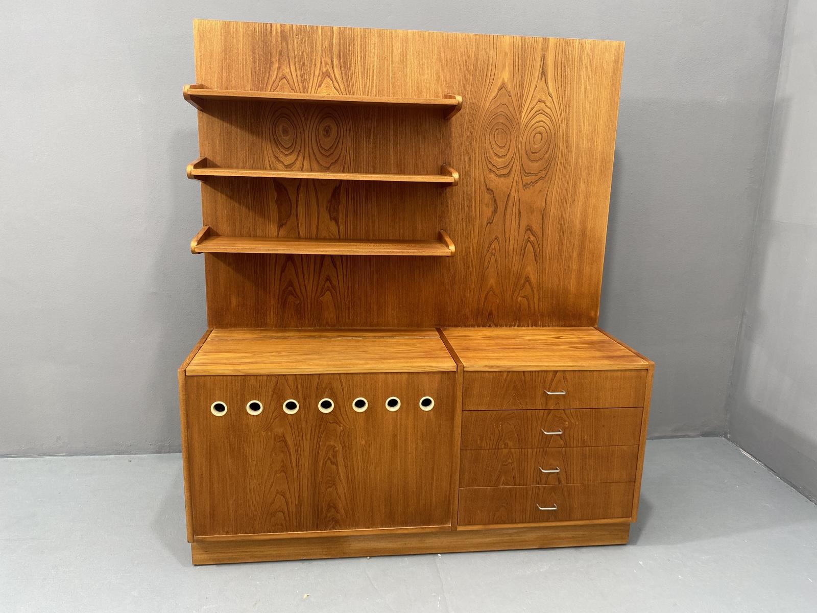 Mid century wall shelf system from the 1960´s. It was by Český nábytek company in the former Czechoslovakia.
The system includes three solid shelves, a bedding cabinet and chest of drawers.
It´s made of beech wood.
In excellent condition, it shows