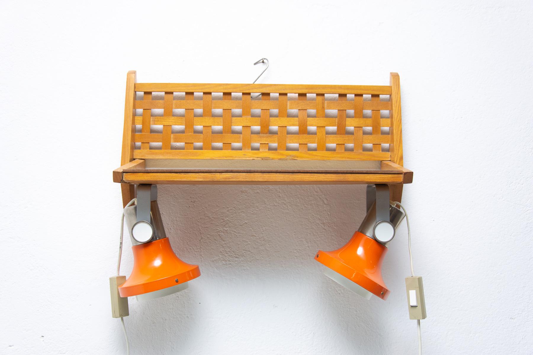 Mid century wooden shelf made by ULUV company in the former Czechoslovakia in the 1960´s.
It´s made of beech wood, interesting are two built-in wall lamps. E27 bulb, Up to 250V.
In good Vintage condition, showing slight signs of age and