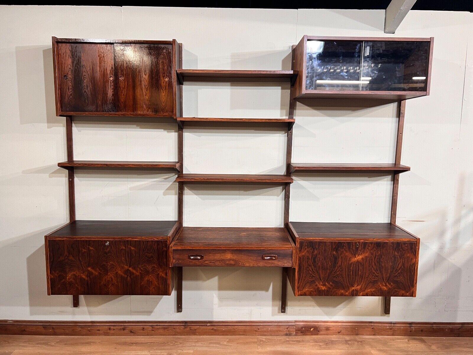 On trend Mid Century teak Danish wall unit by Poul Cadovius
Great piece that hangs to the wall and features a desk, cabinets and numerous shelves
Circa 1960 on this vintage piece of furniture
Poul Cadovius (1911 - 2011) was one of the most colourful