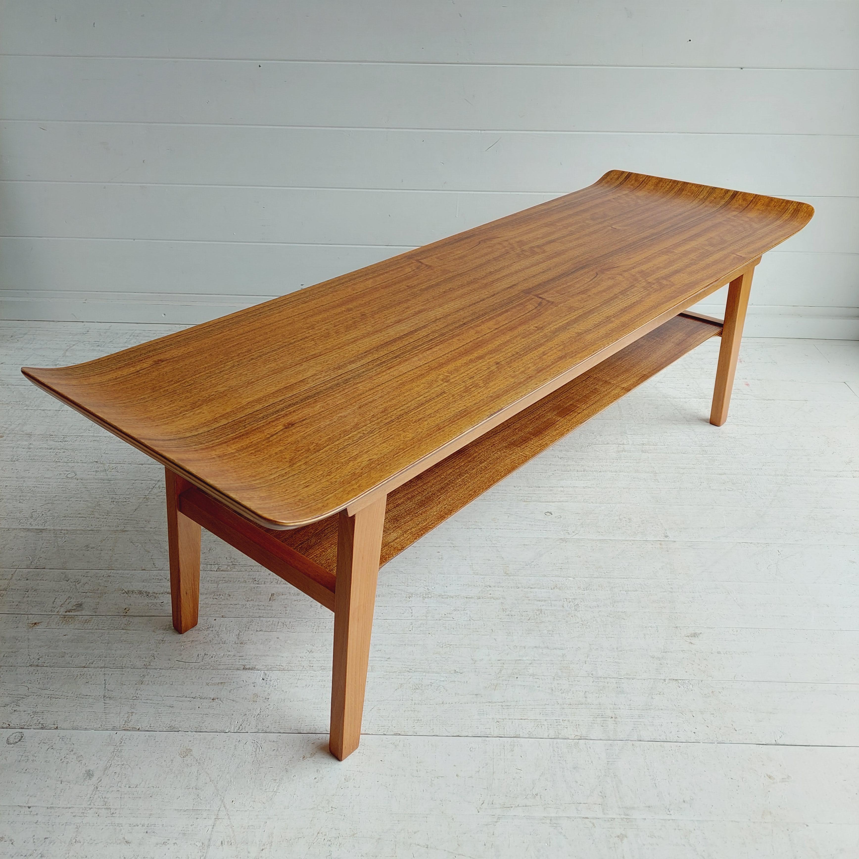 A 1950/60’s ‘Ski’ form coffee table by Ewart Myer for Horatio Myer and Co
Two tier with a sleigh walnut bentwood top and magazine rack shelf to the bottom. 

Ewart designs a rather unique coffee table. 
Taking inspiration during the height of the
