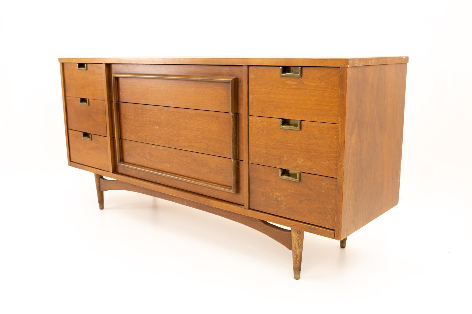 Midcentury walnut and brass 9 drawer lowboy dresser
Dresser measures: 60.5 wide x 18.5 deep x 30.5 high

All pieces of furniture can be had in what we call restored vintage condition. That means the piece is restored upon purchase so it’s free of