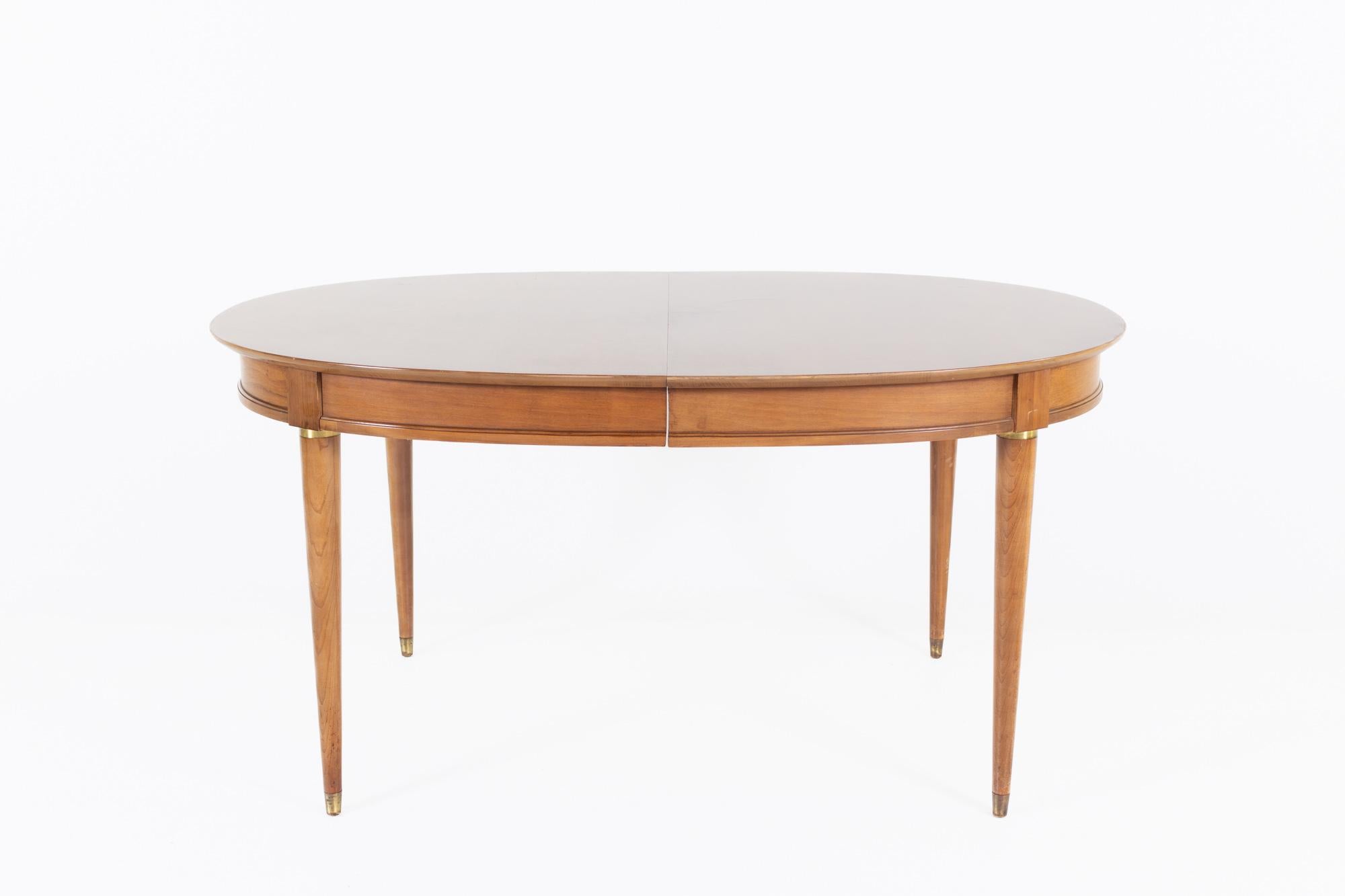 Lane First Edition Cherry and brass expanding dining table with 3 leaves

This table measures: 58 wide x 40 deep x 28.5 high, with a chair clearance of 24 inches, each leaf measures 12 inches wide, making a maximum table width of 94 inches when