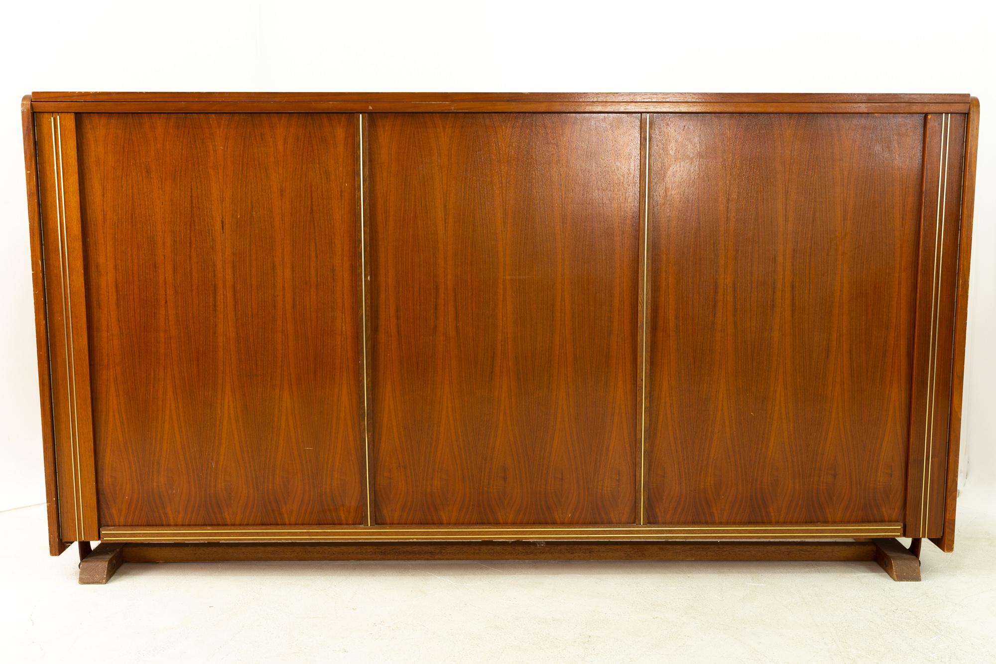 Midcentury walnut and brass full murphy bed
Measures: 76.5 wide x 17 deep x 40.5 high
See below for 5 ways to save!
Free restoration: When you purchase a piece we carefully clean and prepare it for shipping. If during re-inspection we discover a