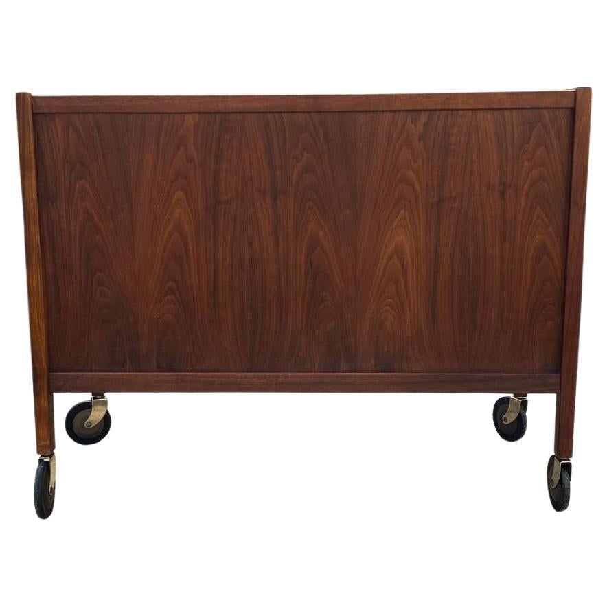 Mid-Century Modern Mid century walnut and cane bar cart on casters by Jack Cartwright Founders