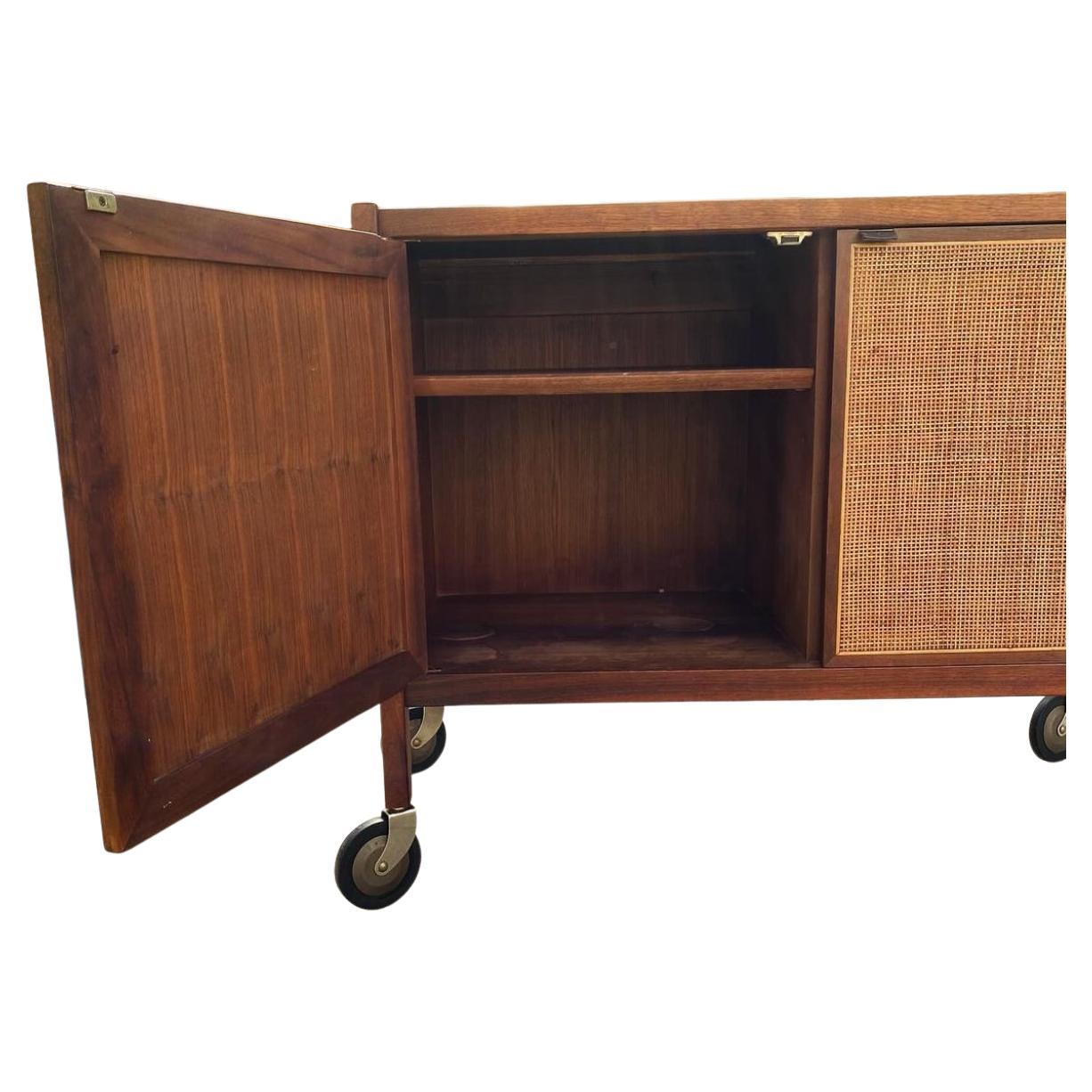 American Mid century walnut and cane bar cart on casters by Jack Cartwright Founders