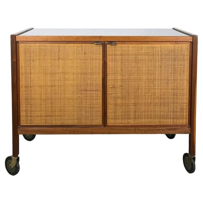 Mid century walnut and cane bar cart on casters by Jack Cartwright Founders