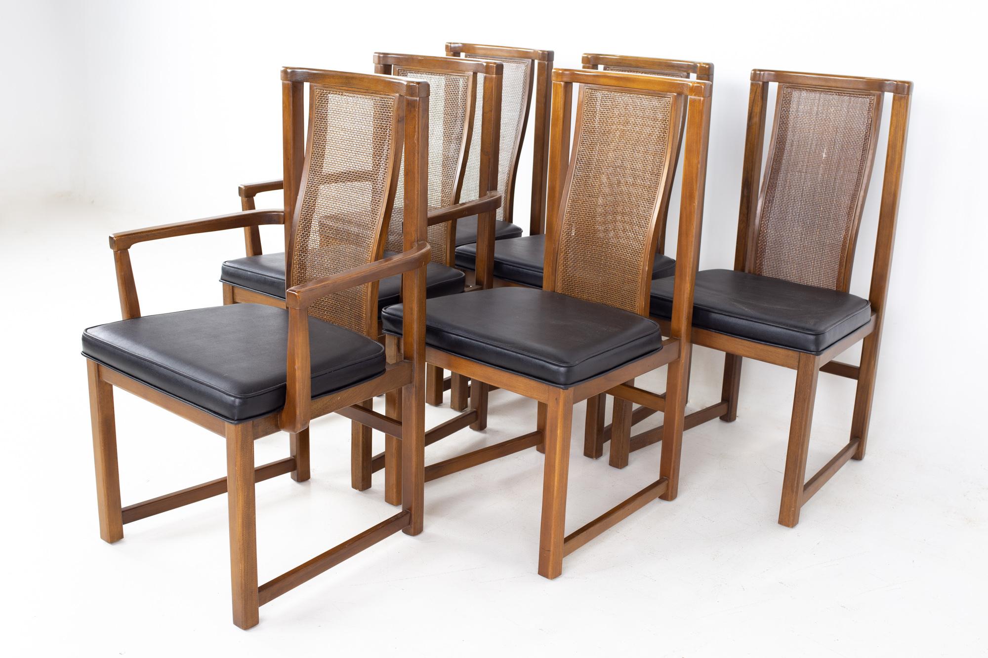 Mid century walnut and cane dining chairs - set of 6
Each chair measures: 24 wide x 20.5 deep x 38.25 high, with a seat height of 18 inches and arm height of 25.5 inches 

All pieces of furniture can be had in what we call restored vintage