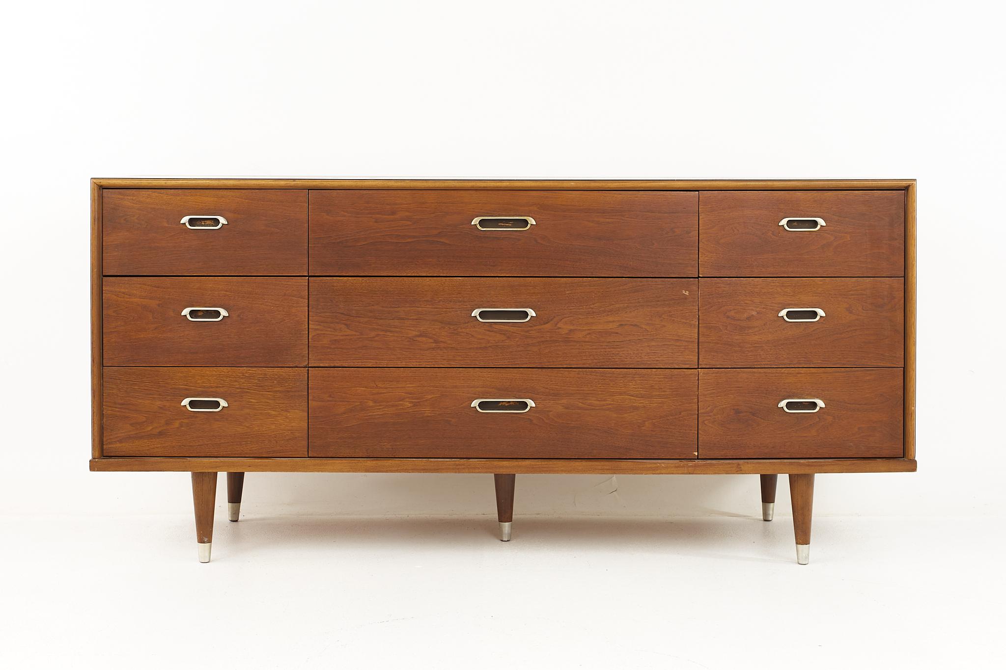 Mid century walnut and chrome 9 drawer lowboy dresser

The dresser measures: 64 wide x 19 deep x 30.5 inches high

All pieces of furniture can be had in what we call restored vintage condition. That means the piece is restored upon purchase so