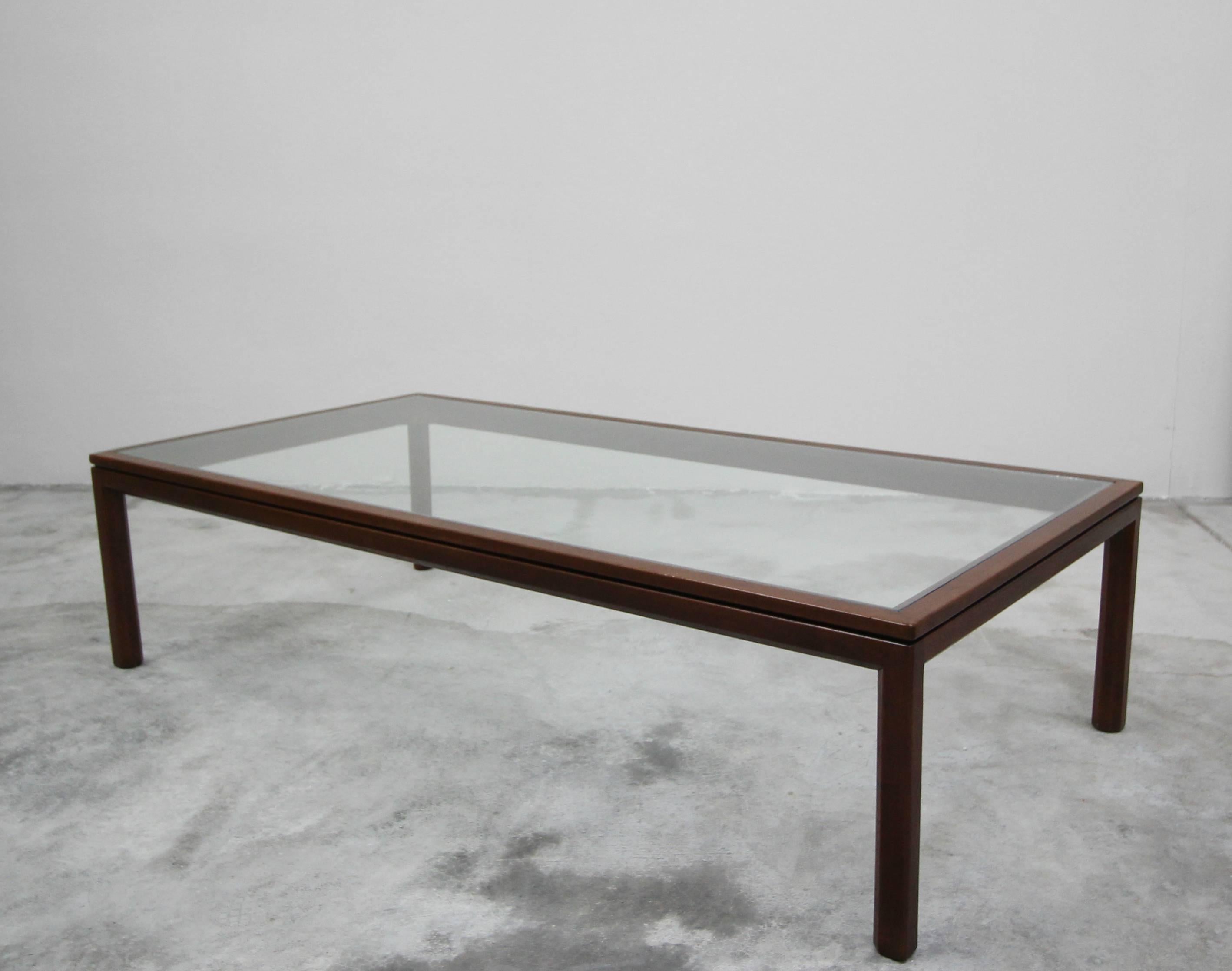 Simple. Beautiful. The perfect Minimalist coffee table. Perfect in any space.

Glass is brand new and the wood is in excellent condition.