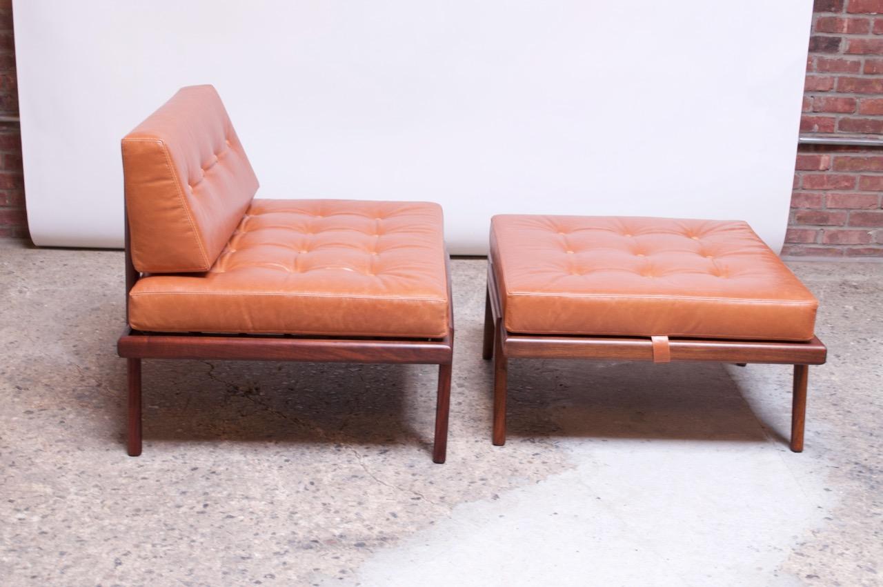 Scarcely seen wide, armless lounge chair designed by Mel Smilow for Smilow-Thielle in the 1950s. Includes the original, oversized ottoman, which can double as a coffee / wide side table (cushion is removable, straps snap into the underside of the