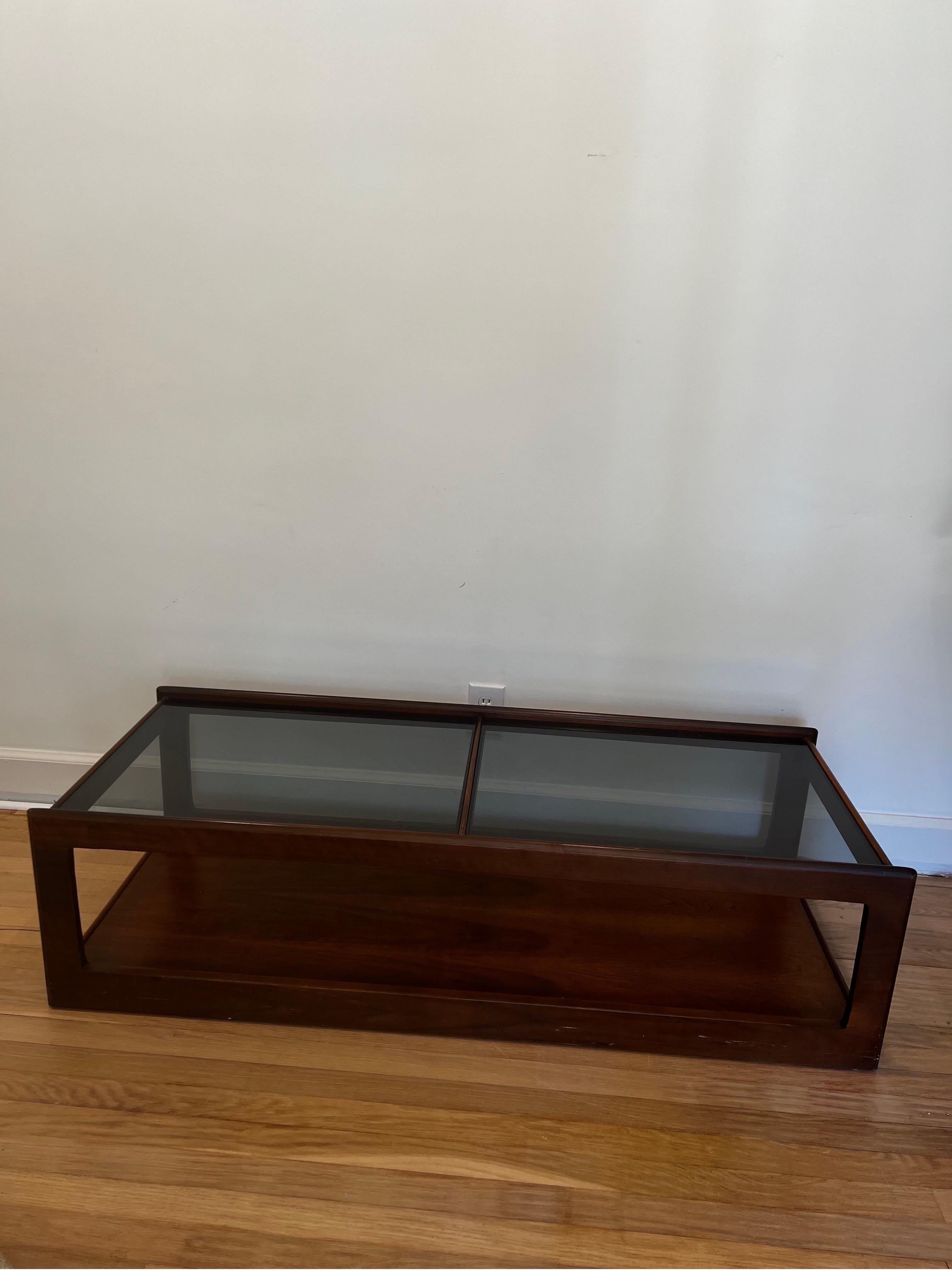 Sleek walnut with smoked glass mid century modern coffee table in the style of John Keal for Brown Saltman.  

*We have a pair of matching end tables.  See our other listing if interested in complete set. 
