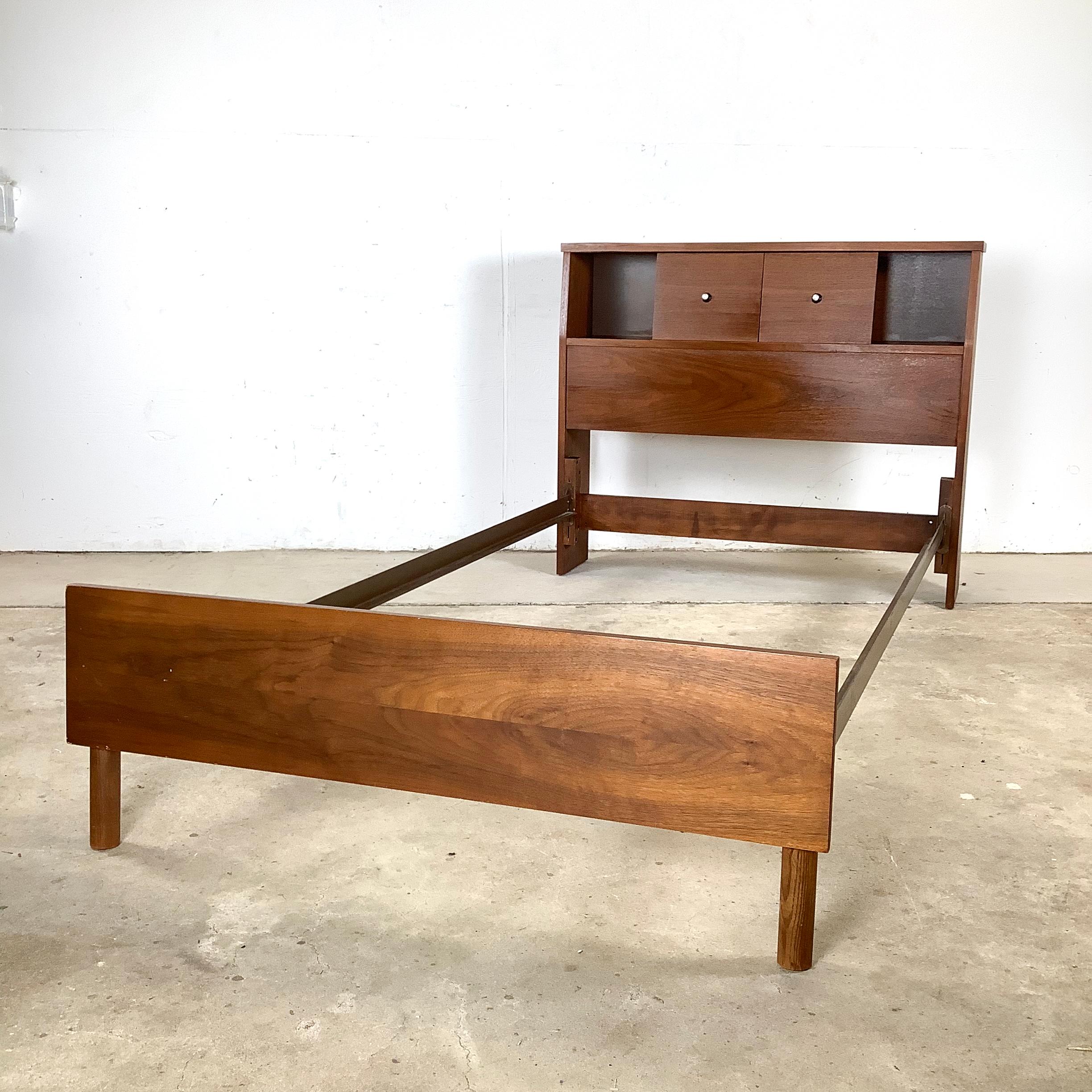 This Mid-Century Modern walnut twin-size bed frame embodies the elegance and functionality that defined the era’s best designs. With its streamlined silhouette, warm walnut grain, and cleverly integrated storage, the piece captures both style and
