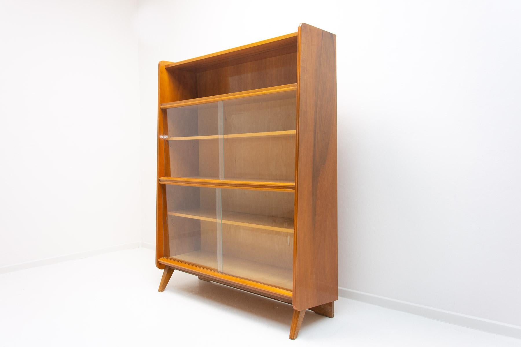 Mid century Vintage bookcase from the 1960´s. It was designed by František Jirák and was manufactured by Jitona company in the former Czechoslovakia. Features a simple design, a glazed section with five storage spaces. In Very good condition.
