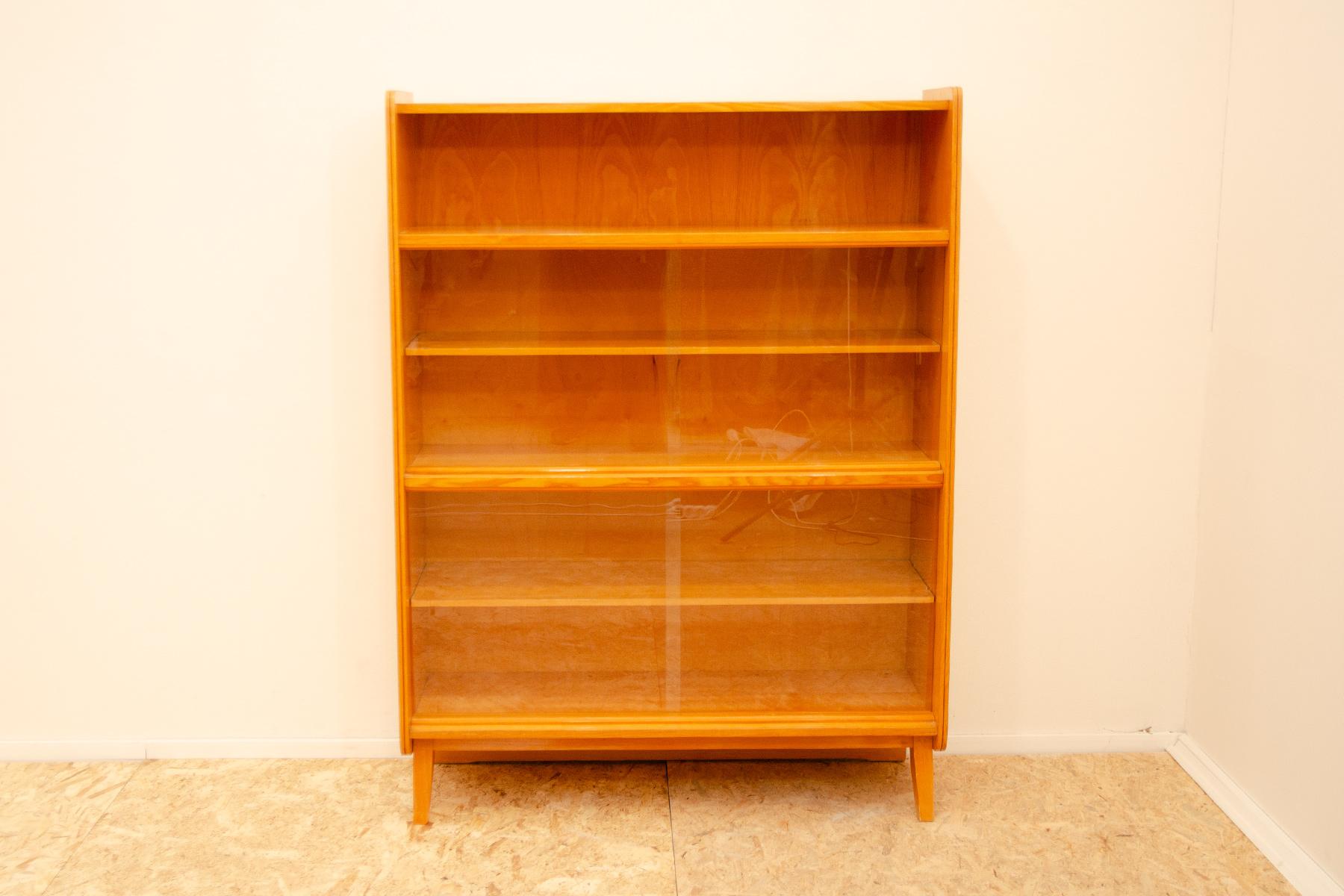 Mid century Vintage bookcase from the 1960´s. It was designed by František Jirák and was manufactured by Jitona company in the former Czechoslovakia. Features a simple design, a glazed section with five storage spaces. Overall in very good Vintage