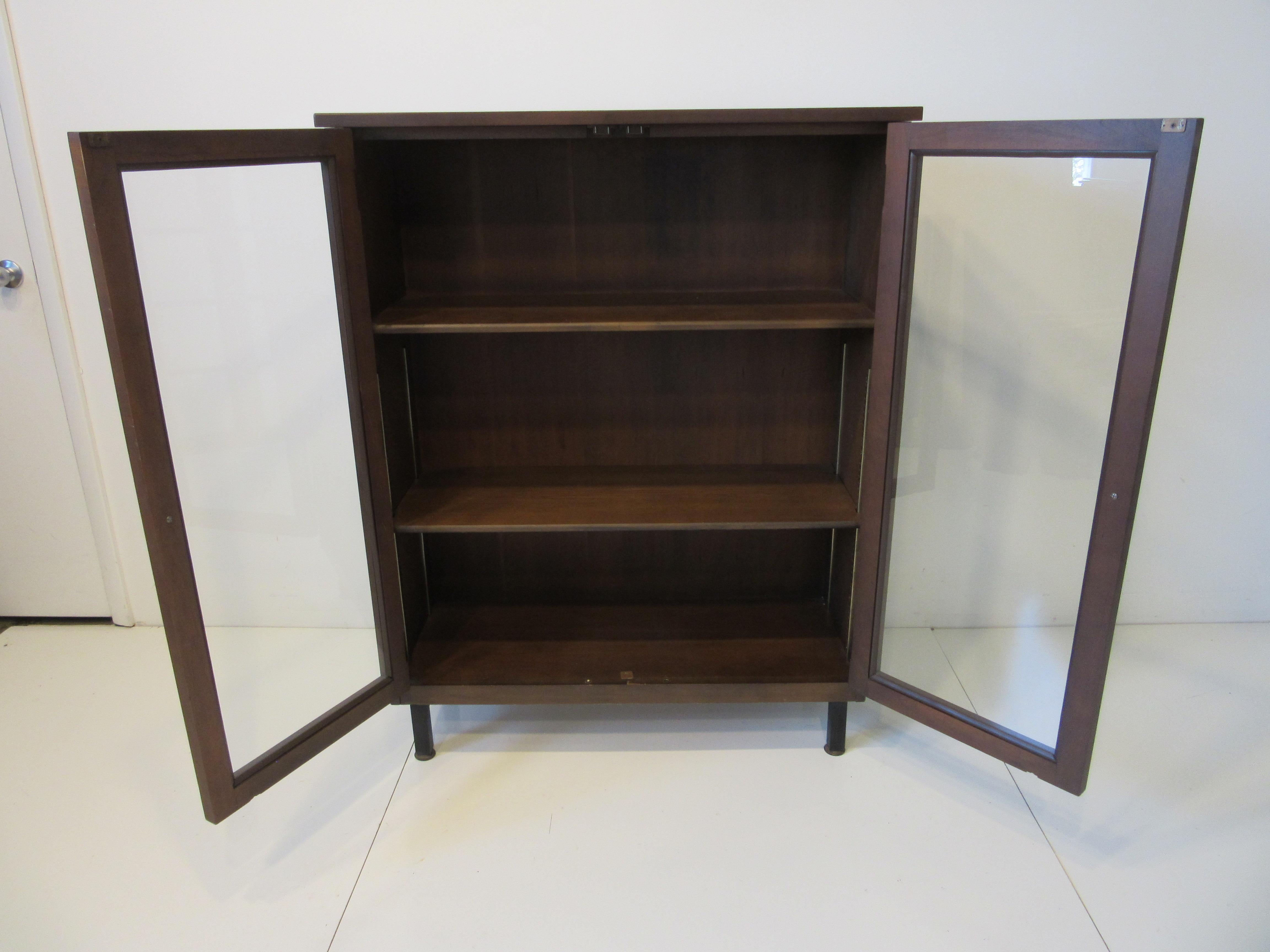 walnut bookcase with glass doors