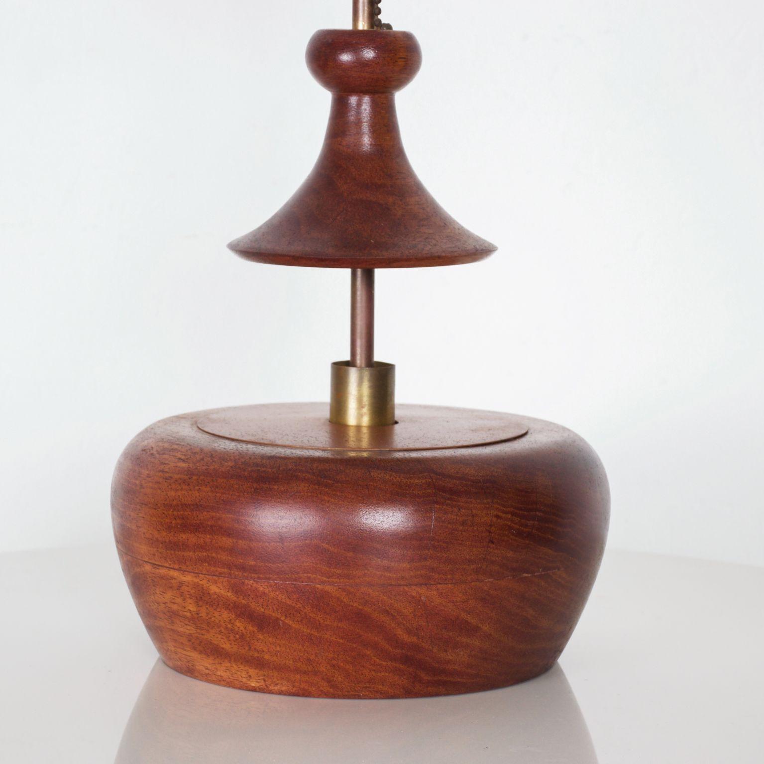 For your pleasure: Mid-Century Modern Walnut Wood with Brass table lamp in sculptural form 

In the style of Tony Paul for Westwood Industries 1950s

Dimensions: 15 1/2