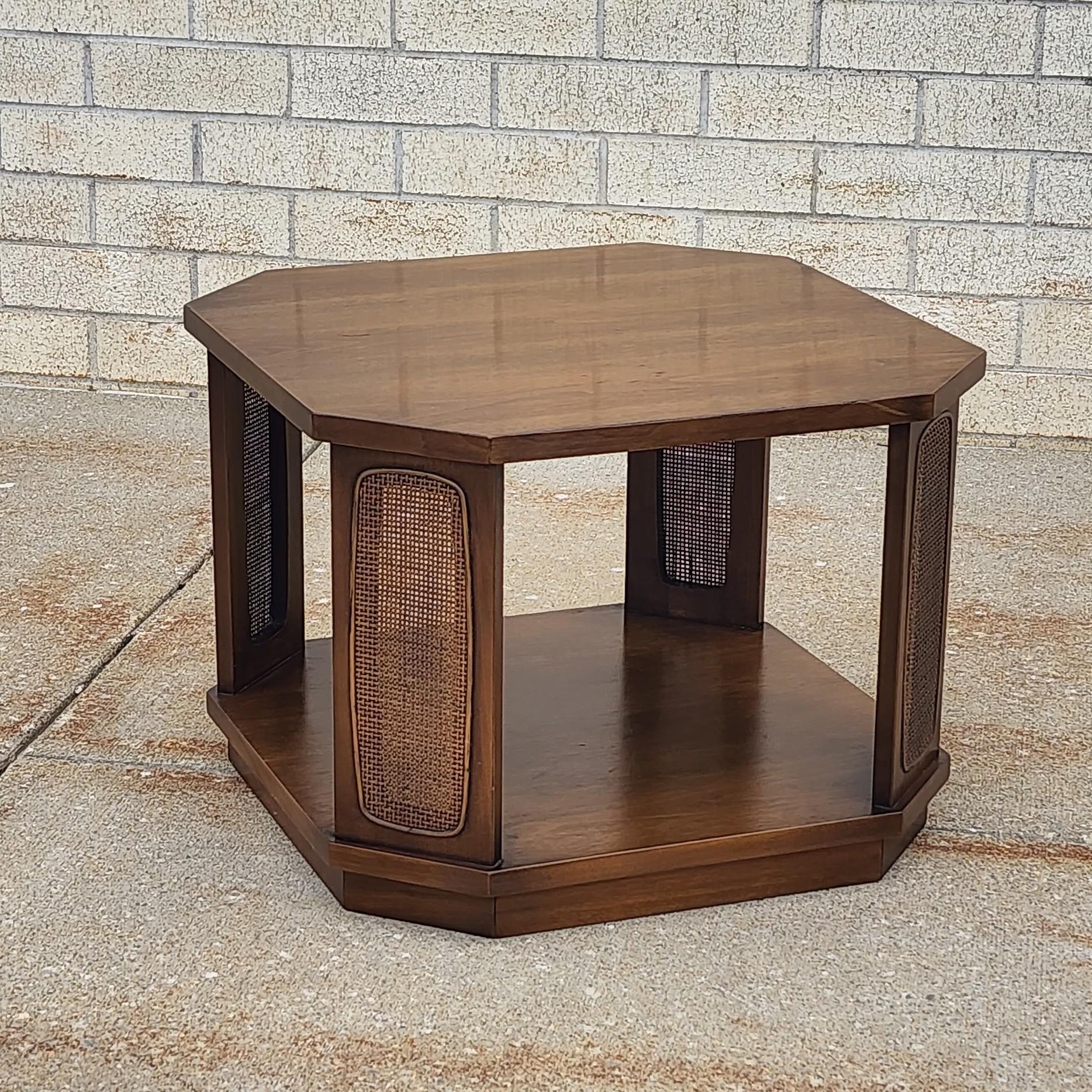 This octagonal side table is nicely made by Broyhill designed for their Premier line. Broyhill makes wonderful lasting designs with excellent quality. Made out of solid hard wood it is sturdy and functionable. It is beautifully done in a rich dark