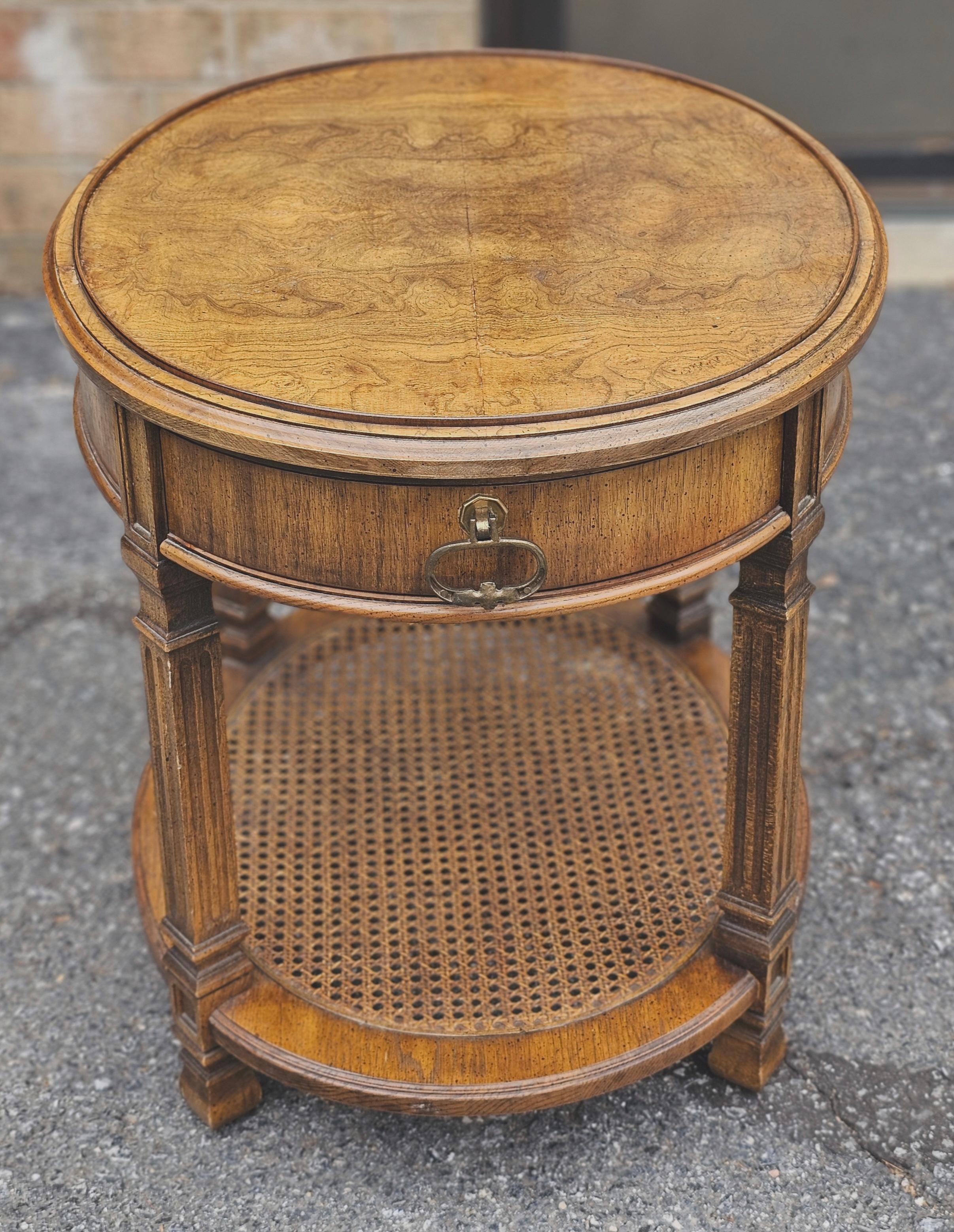 A Mid Century Walnut Burl and Cane Oval Side Table
Measures 21.5