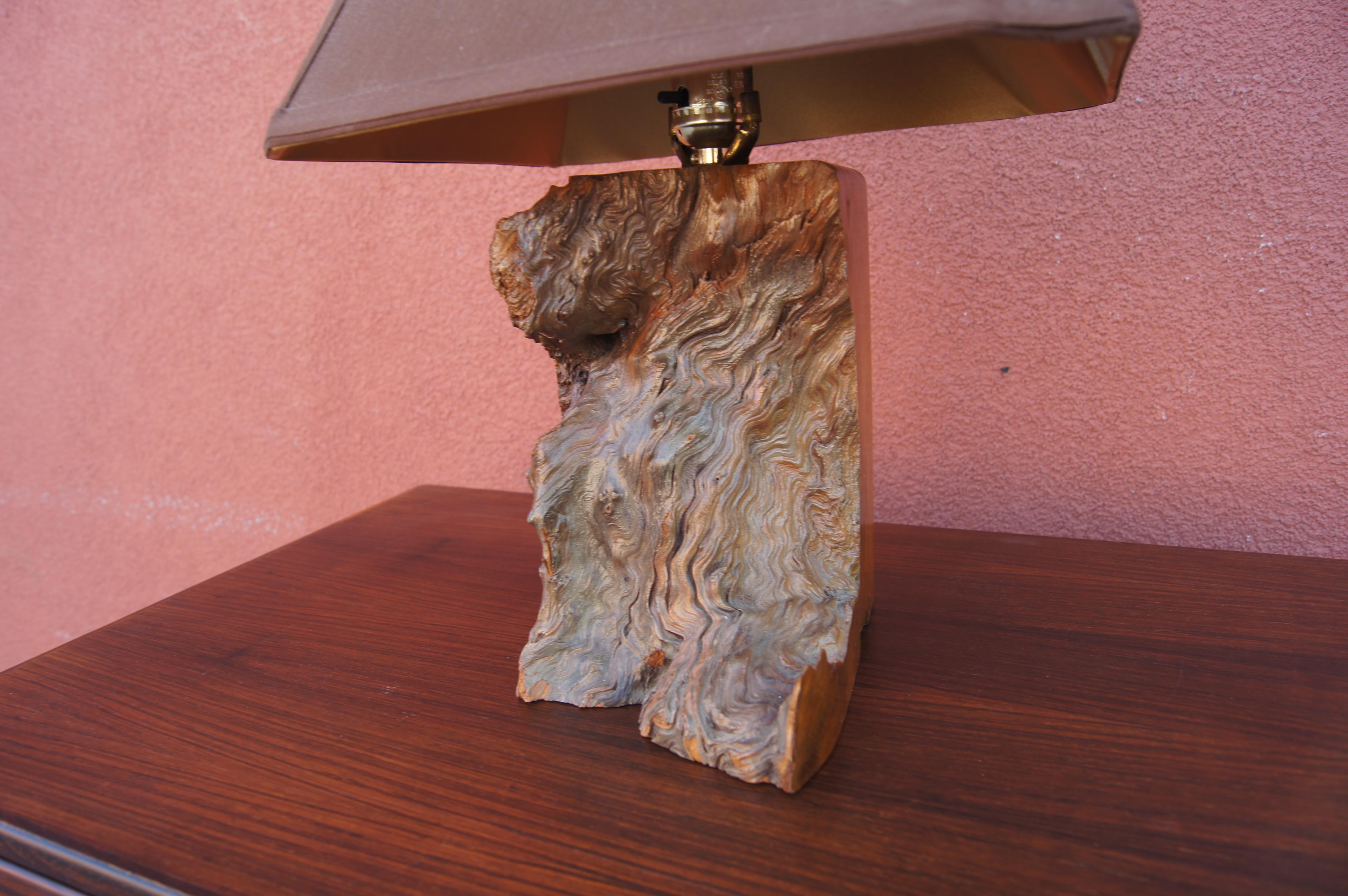 This striking midcentury table lamp has a base of walnut burl that features both polished and live edges, creating complexity of form and hue. The lamp retains its original brown pagoda shade.

Measurement below is to the top of finial.