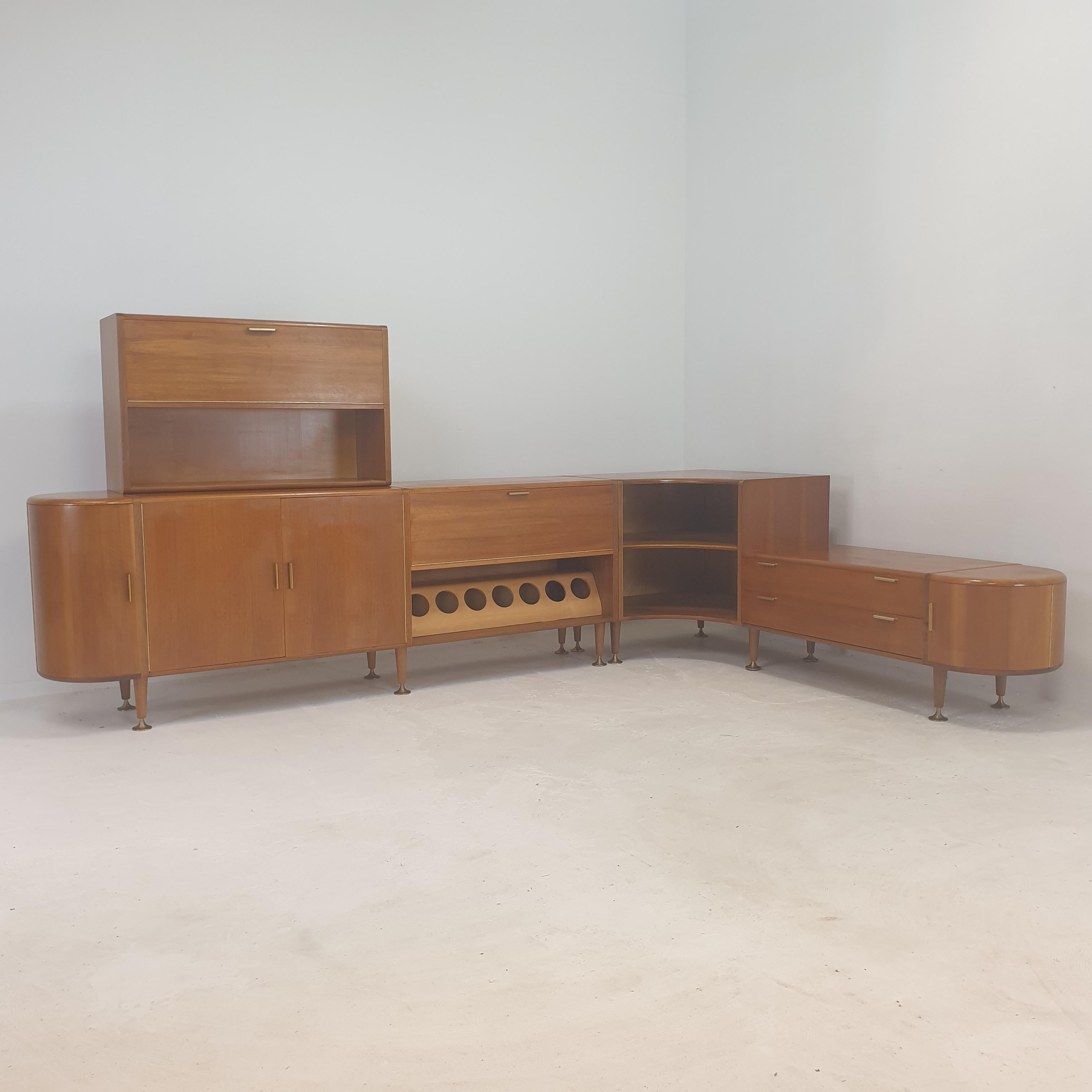 Beautiful walnut cabinet or sideboard, designed by A.A. Patijn for Zijlstra Joure in the 50’s. 

This high quality Dutch cabinet is made with the best materials, it is composed by 3 modules. 
It has very nice brass details and curved doors on