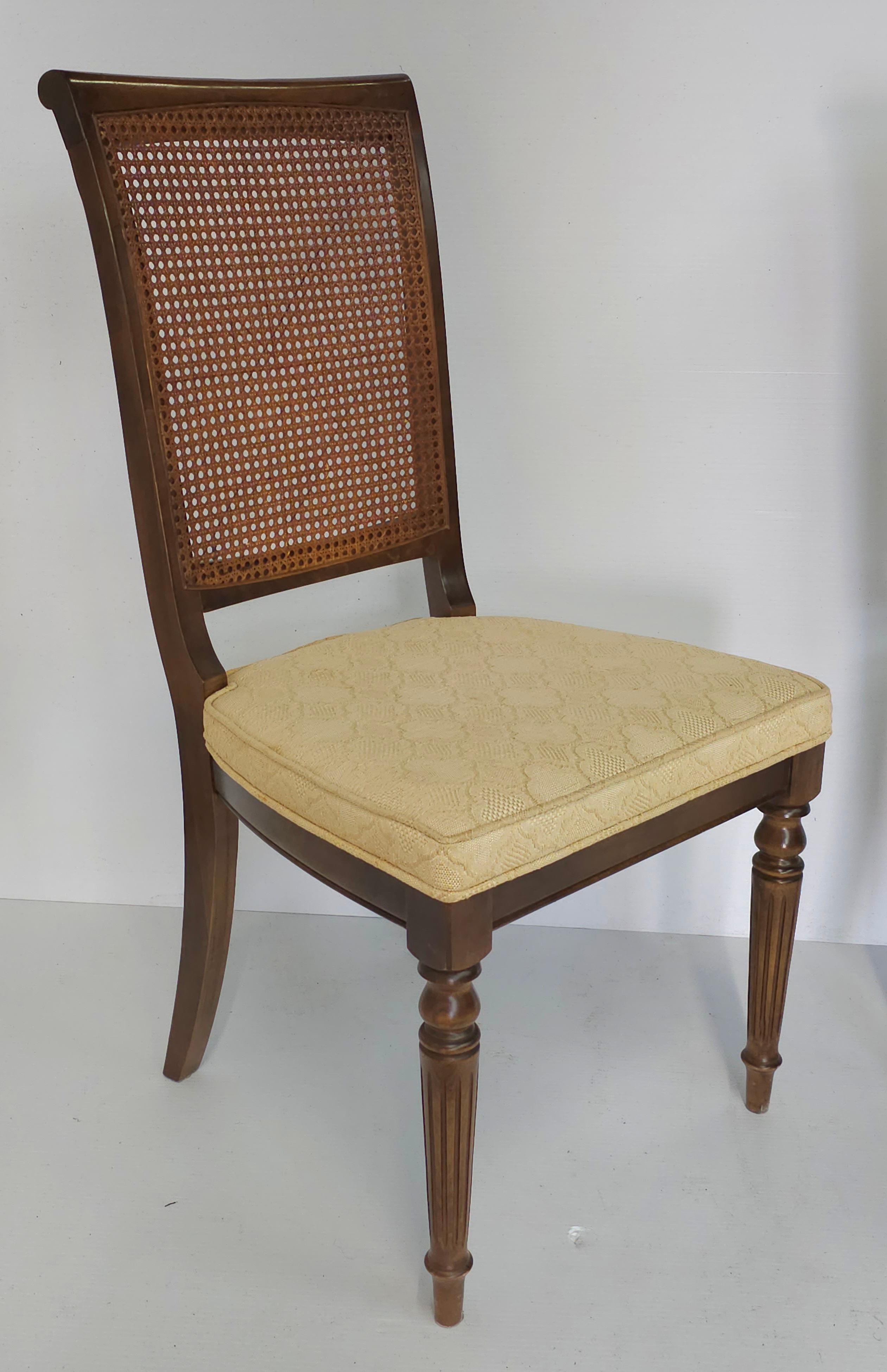 A Mid-Century Walnut Cane Back and Upholstered Side Chairs. Good vintage condition. We have a matching pair available in a separate listing.
Measures 19.5