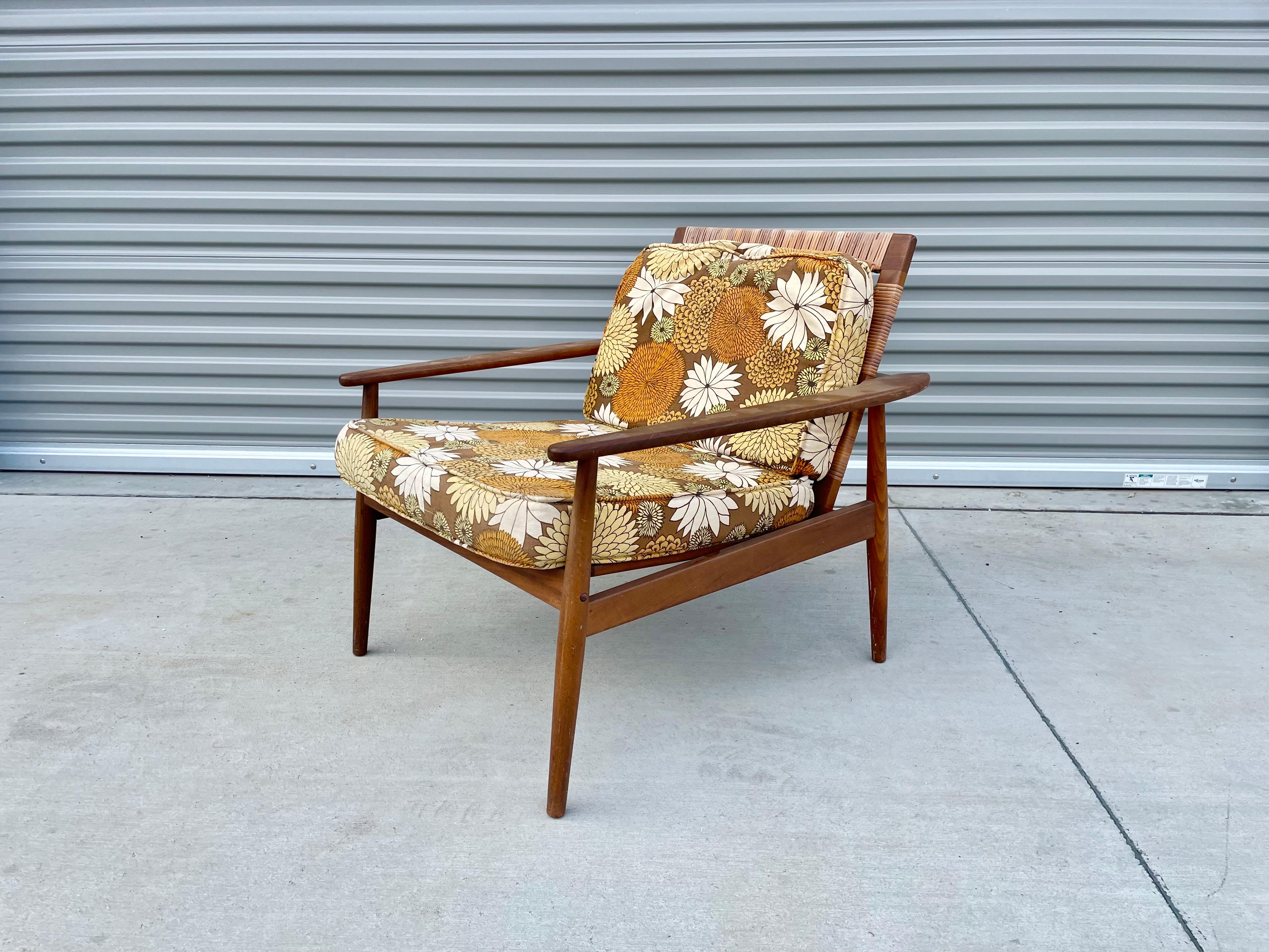 Mid-20th Century Midcentury Walnut Cane Lounge Chair Styled After Hans Olsen For Sale