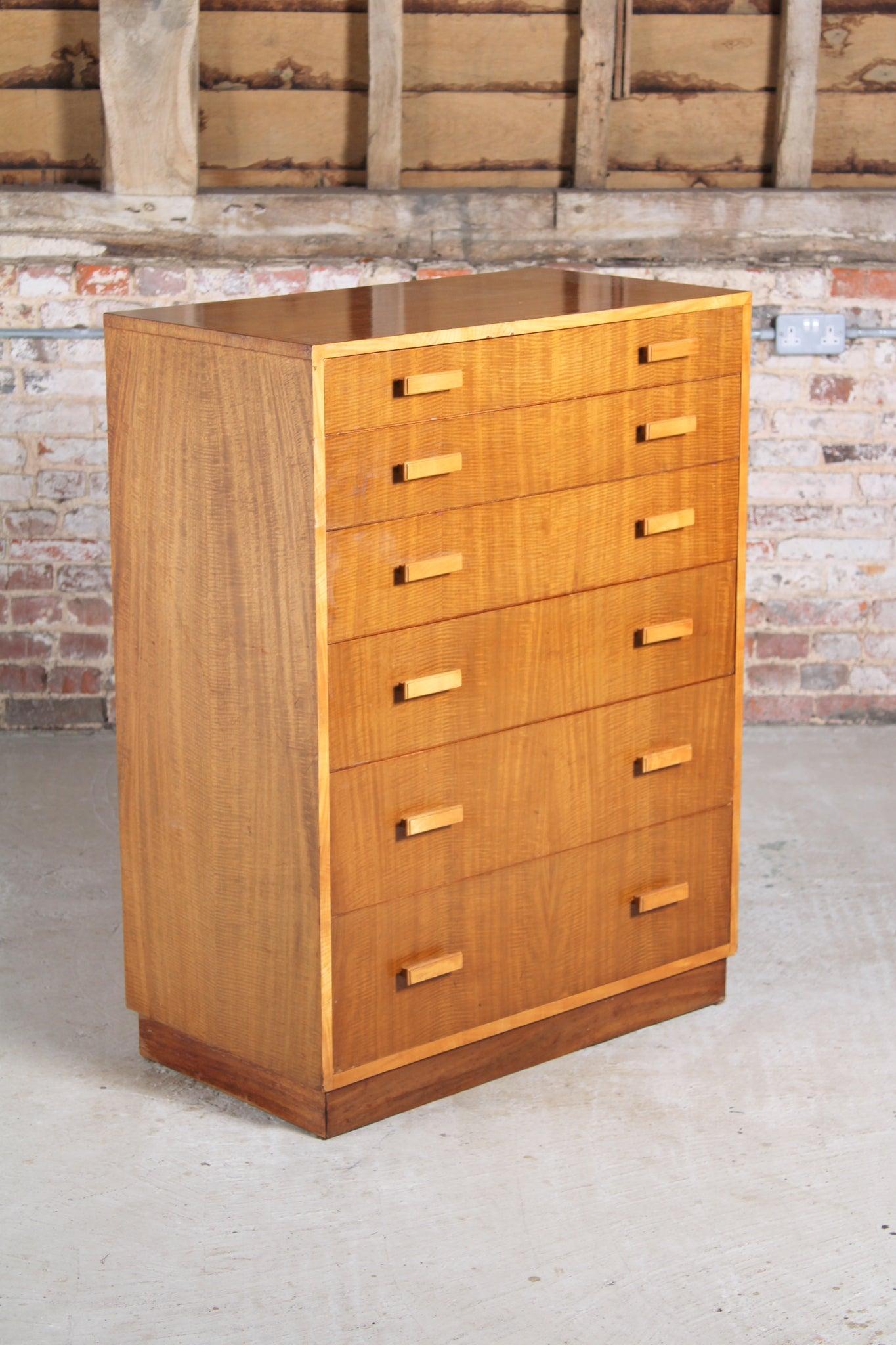Mid-century walnut chest of 6 drawers by Alfred Cox, England, circa 1960s.

Dimension: W 84 cm x H 111 cm x D 46 cm.