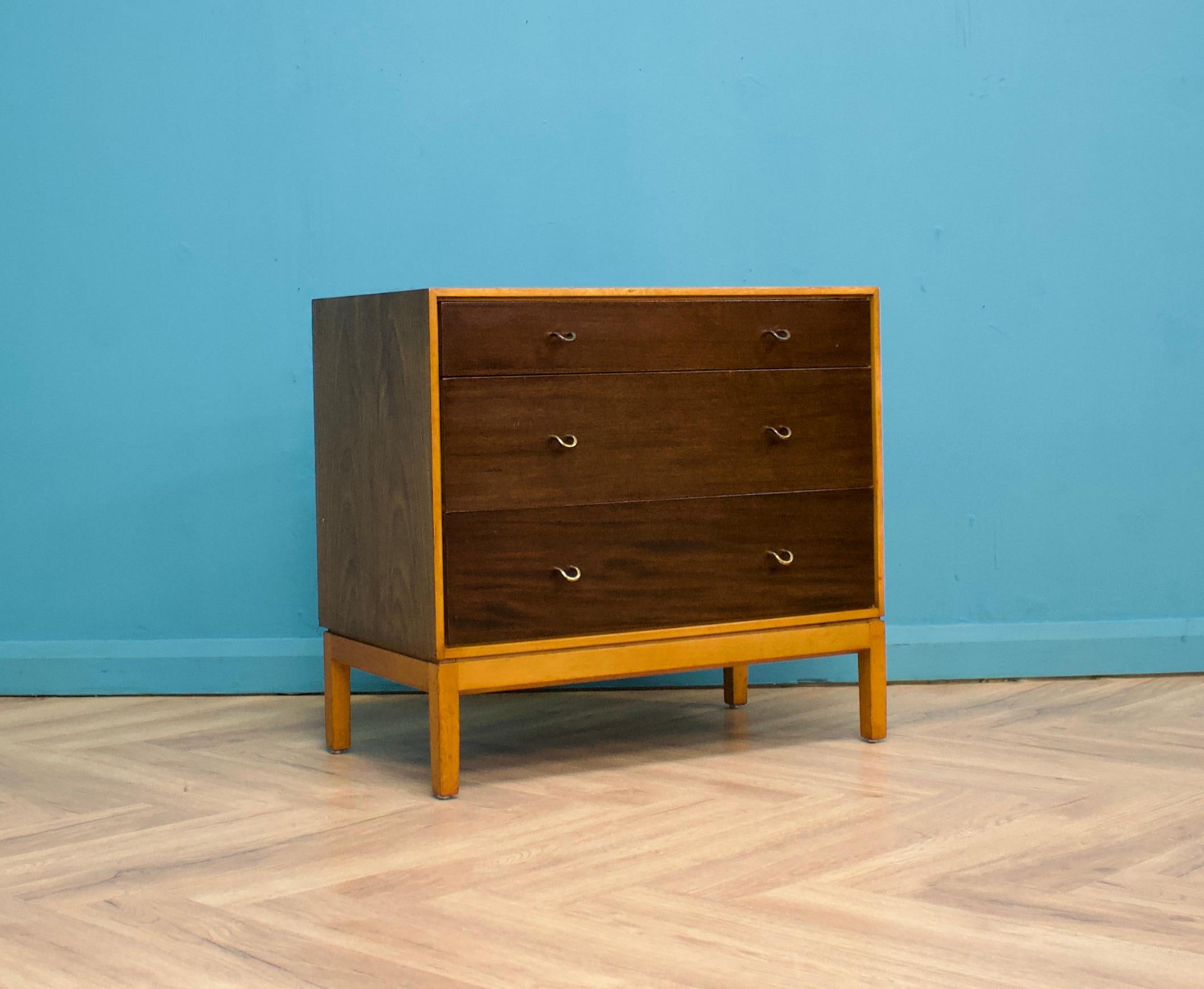 A mid century walnut chest of drawers from the quality furniture makers, Stag
Designed by John & Sylvia Reid
Dating from the late 1950s-early 1960s


There are three drawers in total - each having a solid brass handle


The matching tallboy chest of