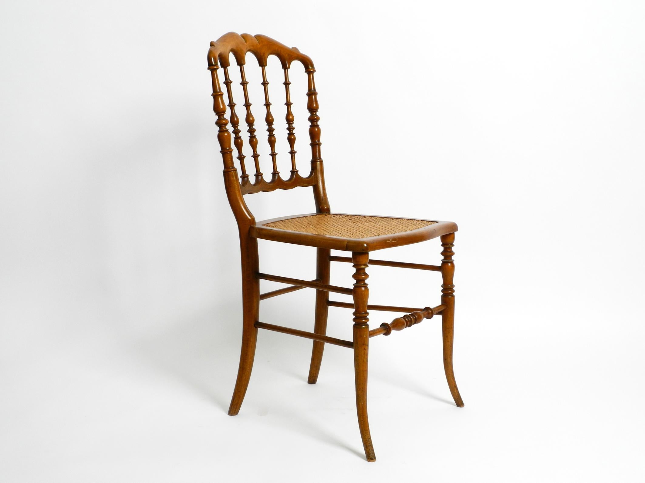 Extremely rare Italian mid-century Chiavari chair made of walnut wood with 
a seat made of Viennese wickerwork.
Based on the design by Giuseppe Gaetano Descalzi.
Descalzi (1767-1855) was a Genoese furniture maker best known for inventing the